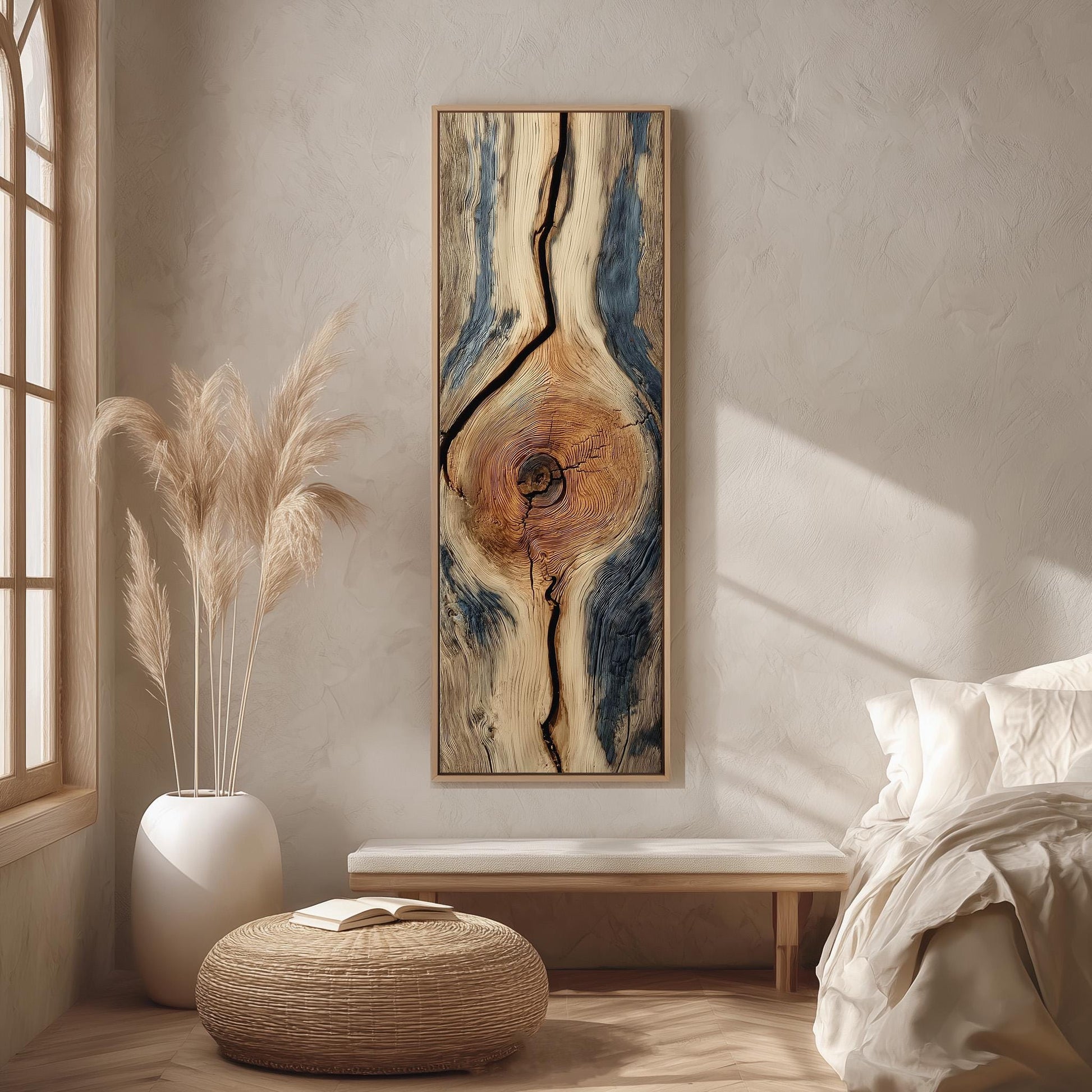a serene and minimalist bedroom interior with a large abstract painting featuring a tree trunk design as the focal point. The room is adorned with a large window, a white bed, a wooden bench, and a woven ottoman. The overall color scheme is neutral, with the painting and the bedding creating a harmonious and calming atmosphere.
