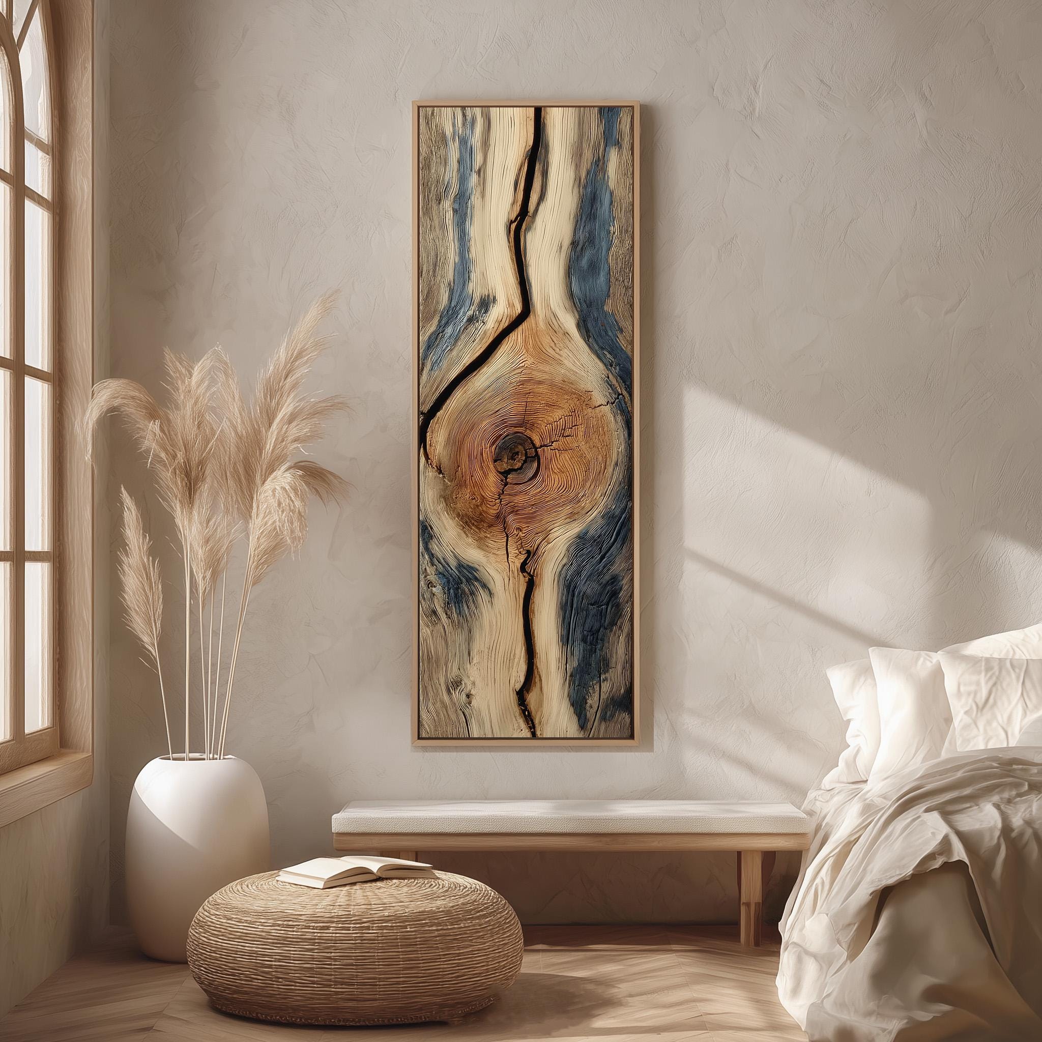 a serene and minimalist bedroom interior with a large abstract painting featuring a tree trunk design as the focal point. The room is adorned with a large window, a white bed, a wooden bench, and a woven ottoman. The overall color scheme is neutral, with the painting and the bedding creating a harmonious and calming atmosphere.