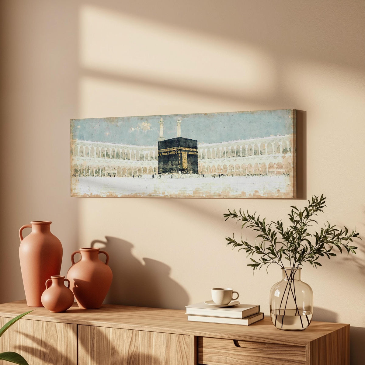 The Kaaba in the Grand Mosque courtyard long horizontal canvas print above a wooden sideboard