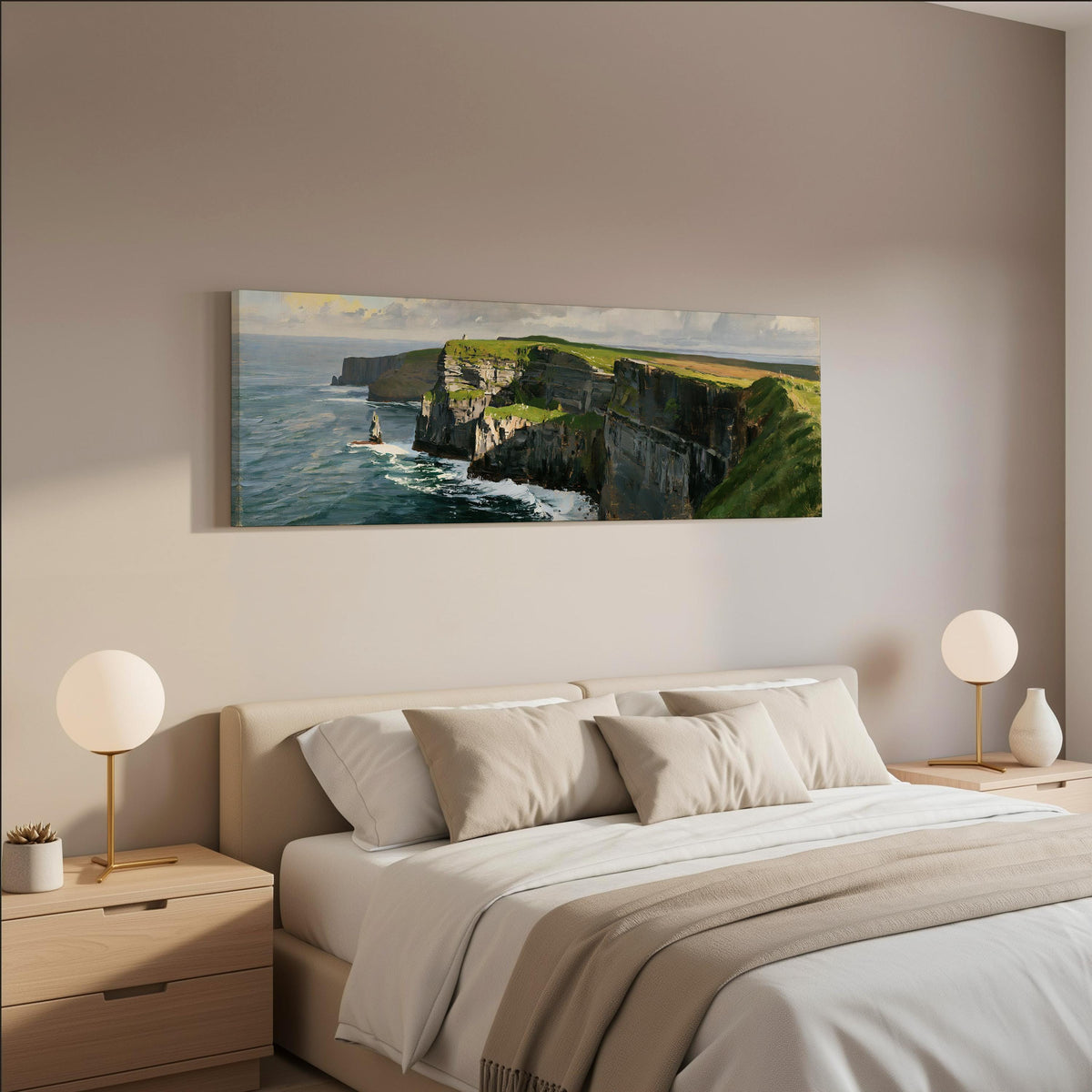 Sunlit sea cliffs with a sea stack wide panoramic canvas print above a bed in a neutral bedroom