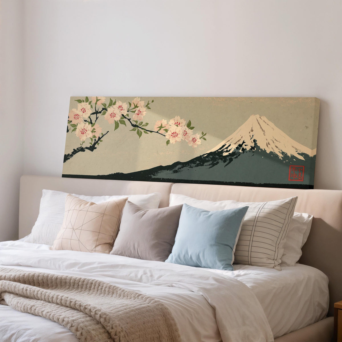 Cherry blossom branch and Mount Fuji wide panoramic canvas print above a bed in a bedroom