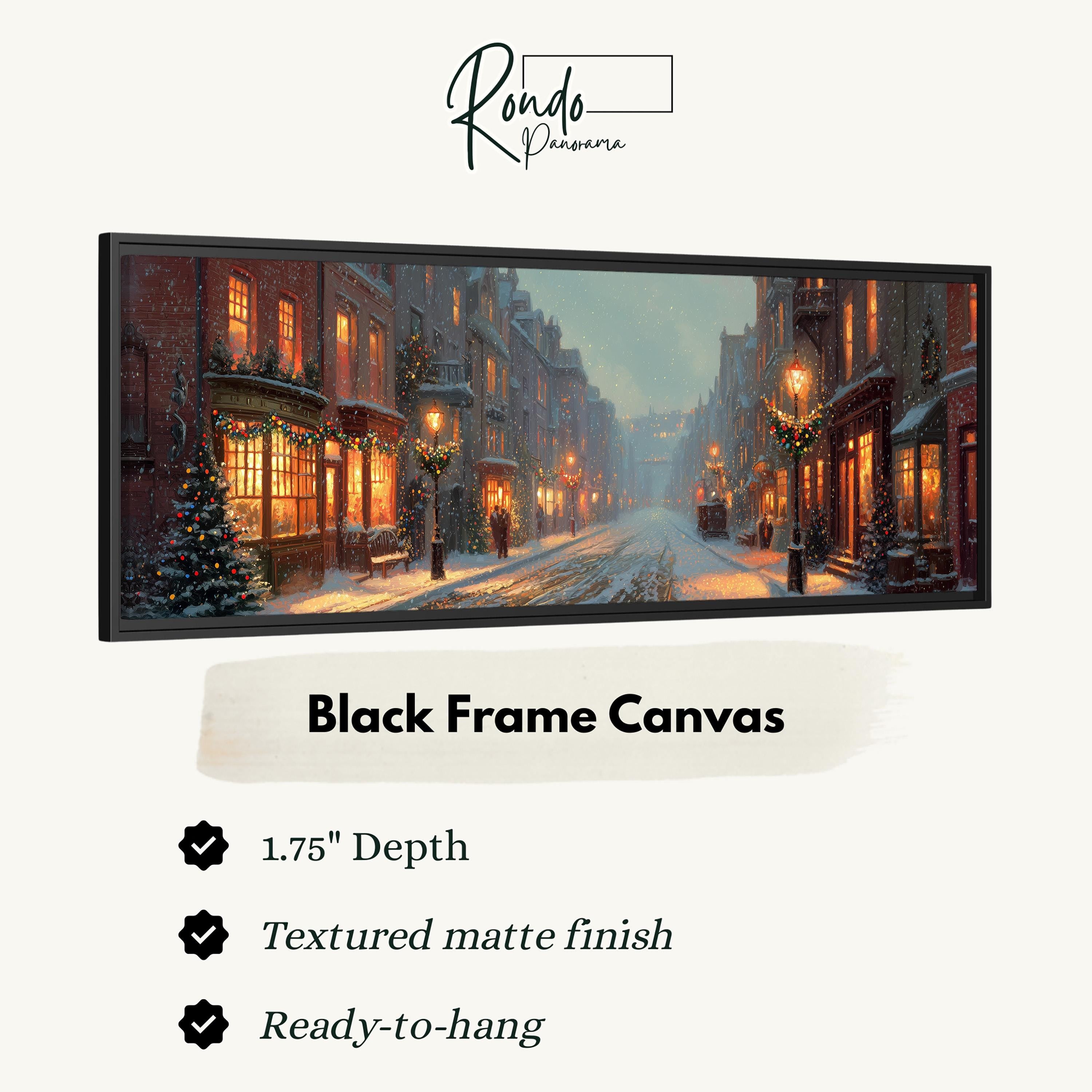 A black frame canvas depicting a snowy city street at night with illuminated buildings and Christmas trees.