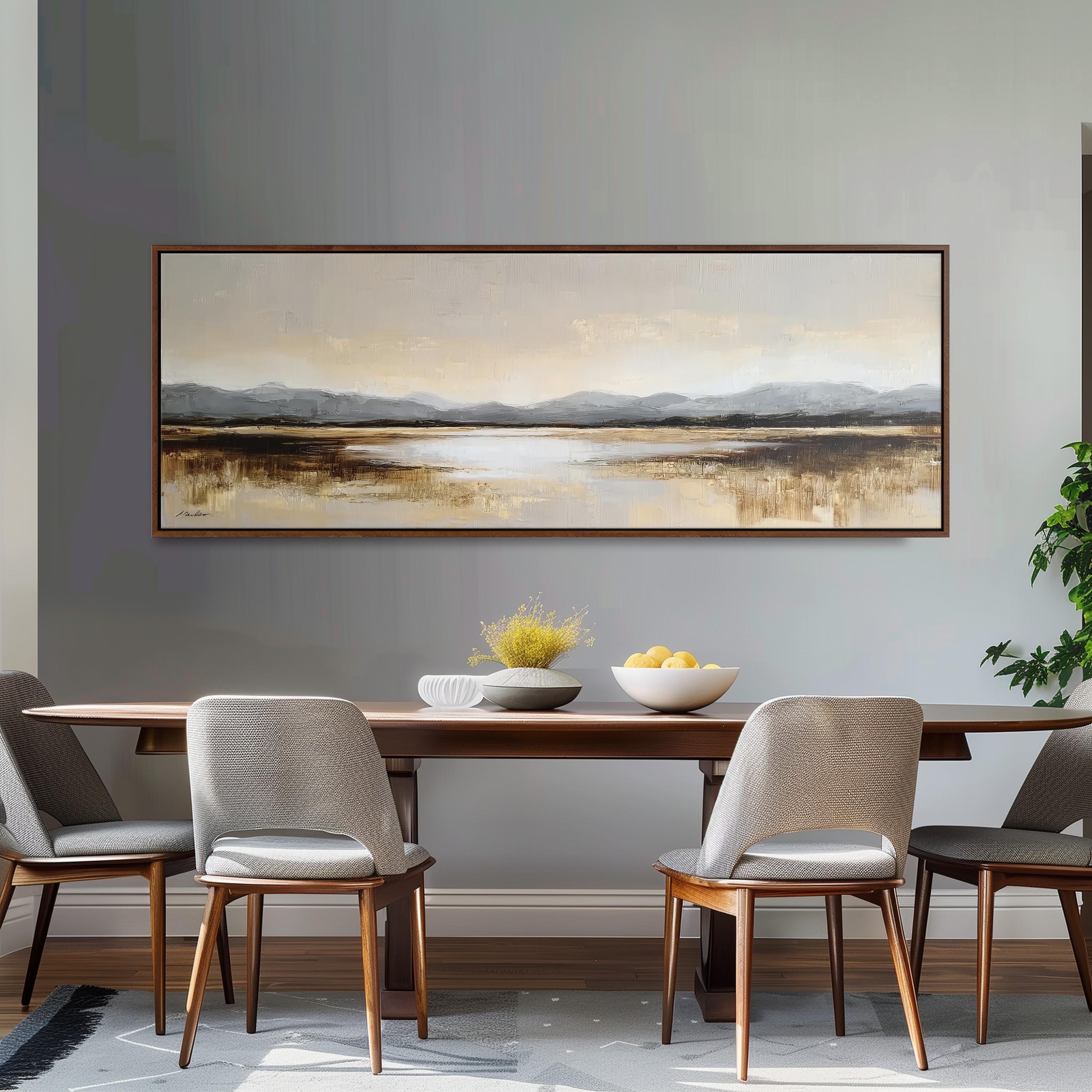 a dining room with a large painting of a landscape hanging on the wall above a wooden dining table with four chairs. The table is set with a bowl of fruit and a vase of flowers, creating a cozy and inviting atmosphere.