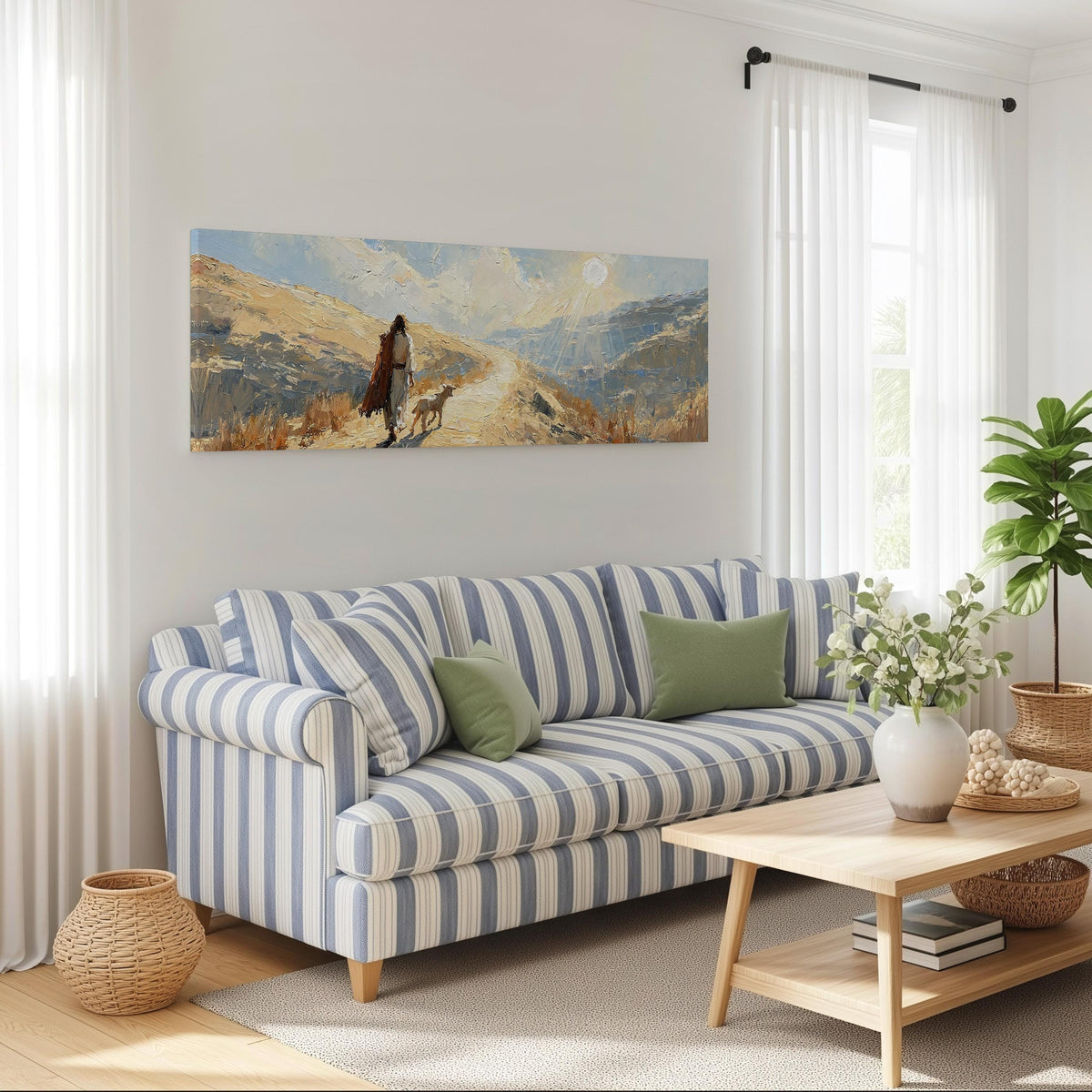 Jesus walking a sunlit hillside path with a sheep long horizontal canvas print above a striped sofa in a coastal living room
