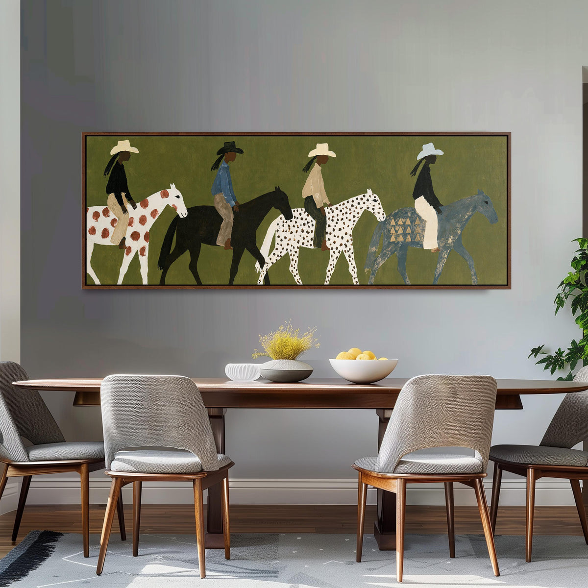 Riders on spotted ponies on olive green long horizontal canvas print above a sofa in a living room