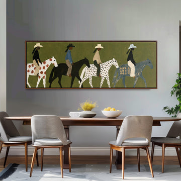 Riders on spotted ponies on olive green long horizontal canvas print above a sofa in a living room