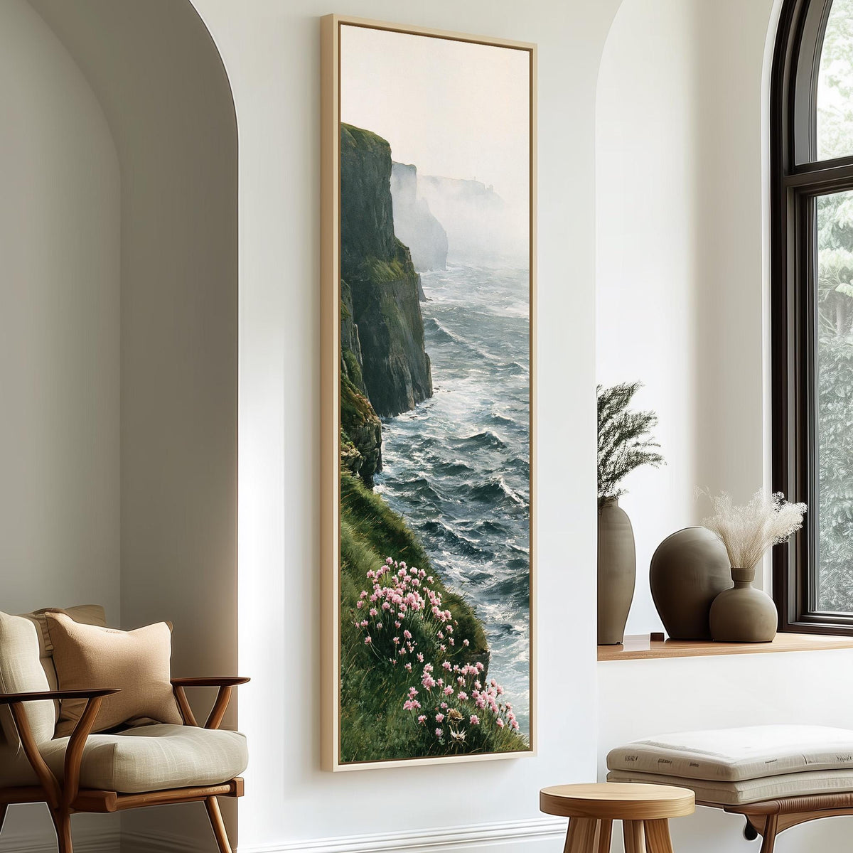 Misty sea cliffs with pink wildflowers tall skinny canvas print in a sunlit living space