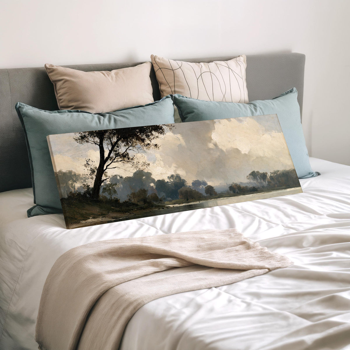 Misty river landscape in grey blue tones wide panoramic canvas print laid on a bed to show its size