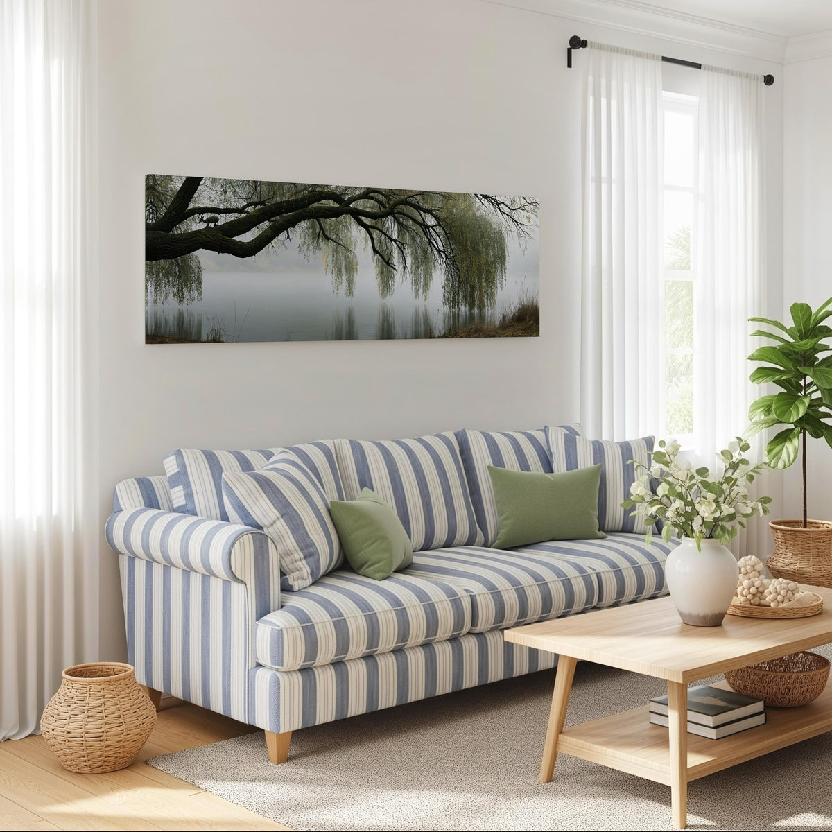 Weeping willow over a misty lake long horizontal canvas print above a striped sofa in a coastal living room