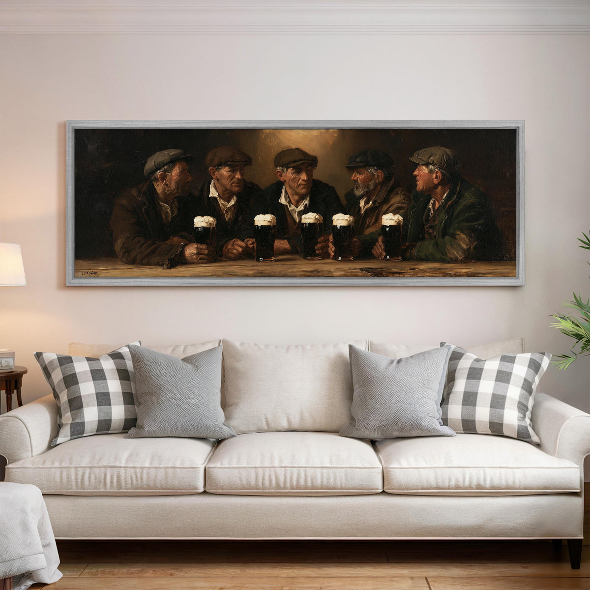 Friends toasting with stout in an Irish pub panoramic canvas print above a white sofa in a bright living room