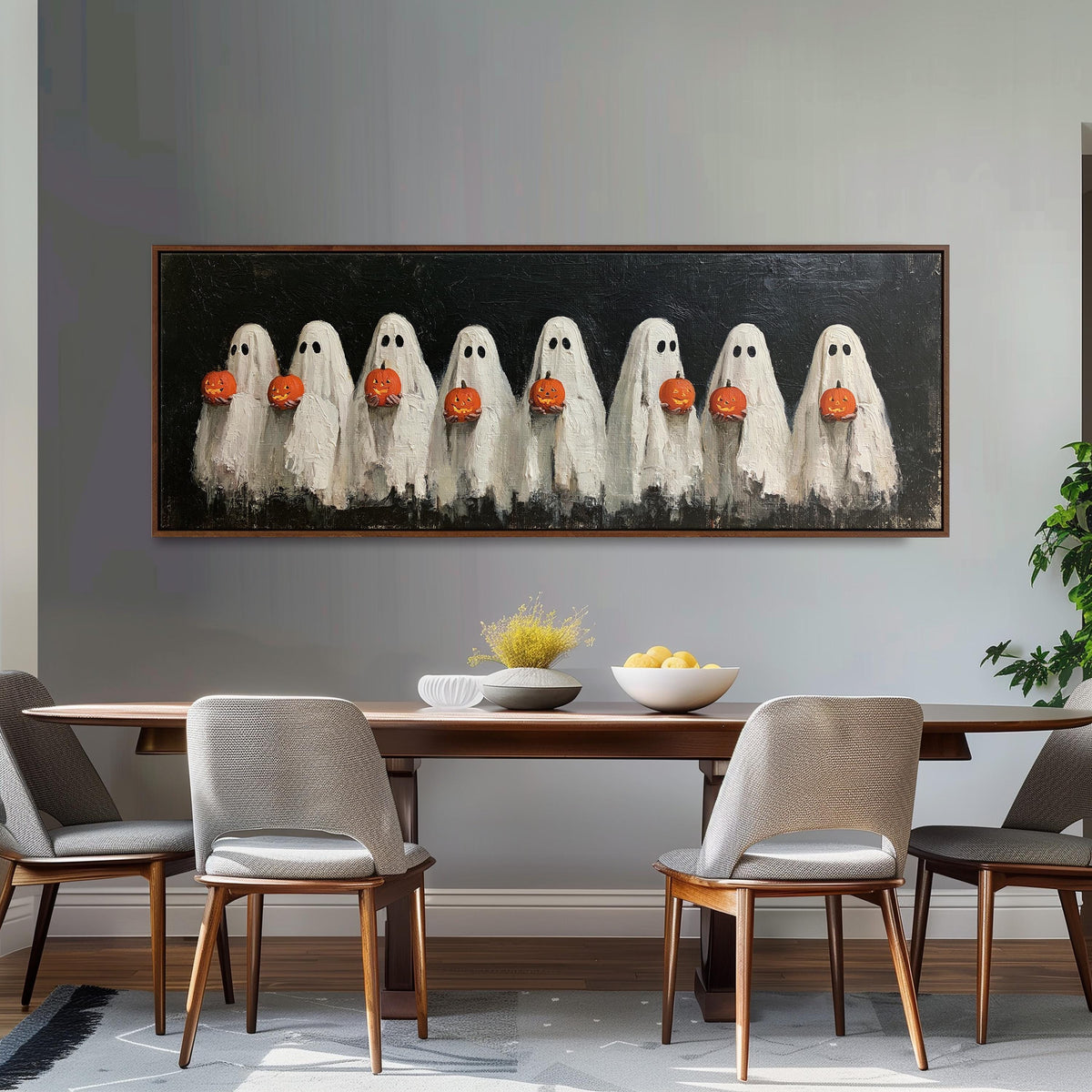 Crowd of huddled ghosts with pumpkins long horizontal canvas print above a dining table