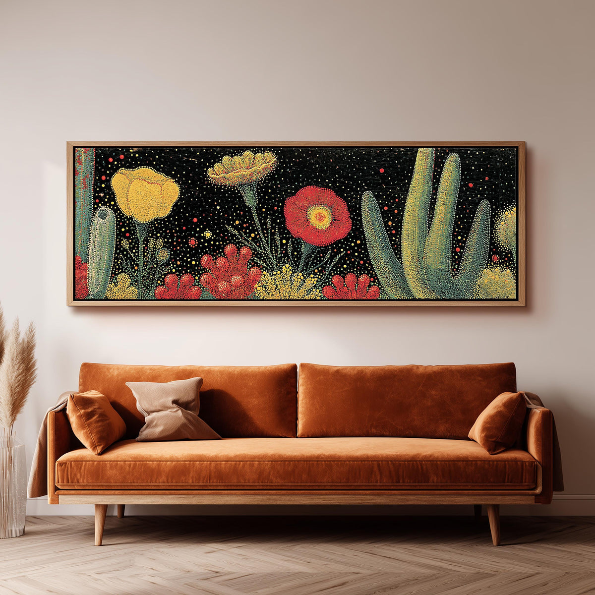 Desert blooms and cacti on black wide panoramic canvas print above a bench in a dark living room