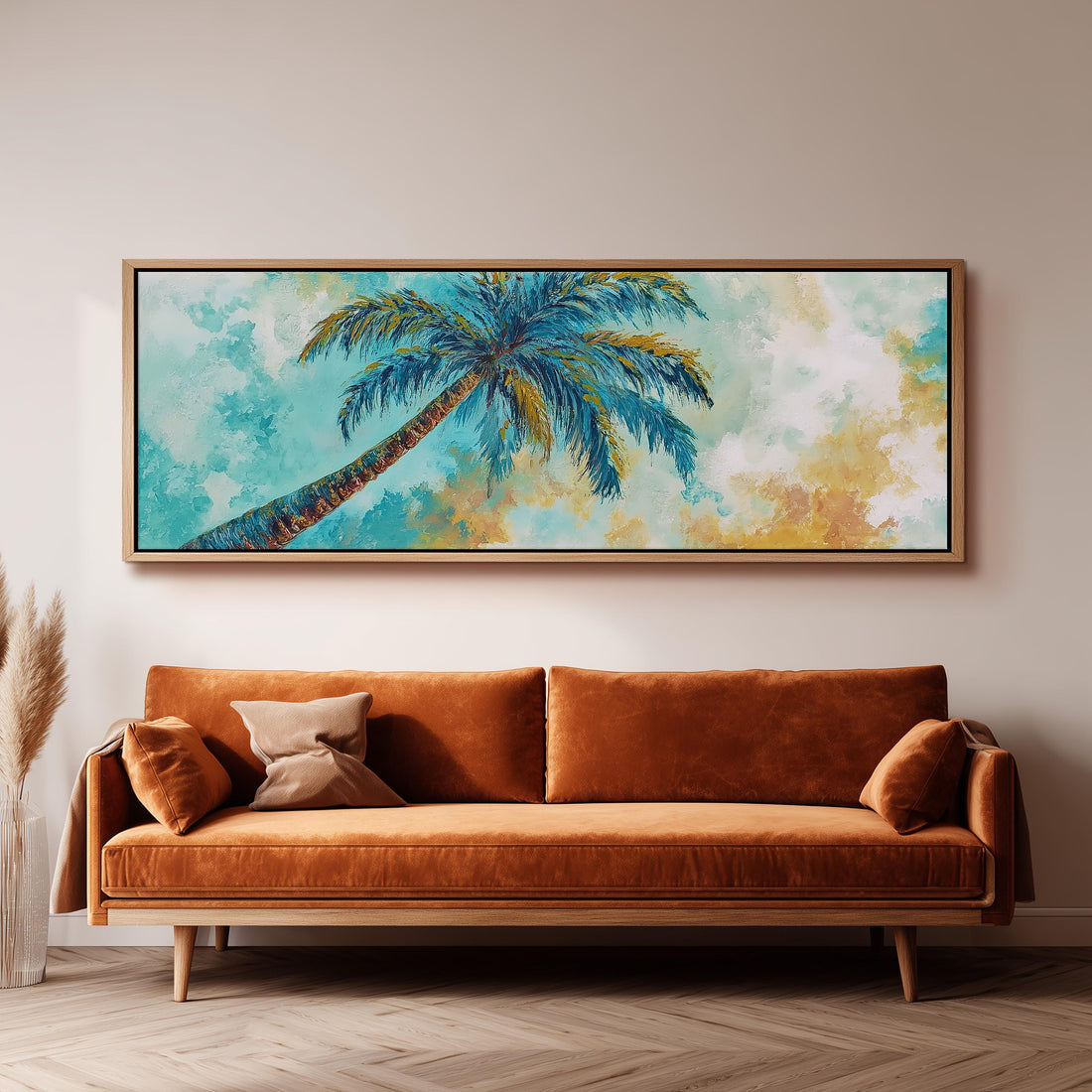 a large, framed painting of a palm tree hanging on a wall above a brown sofa.