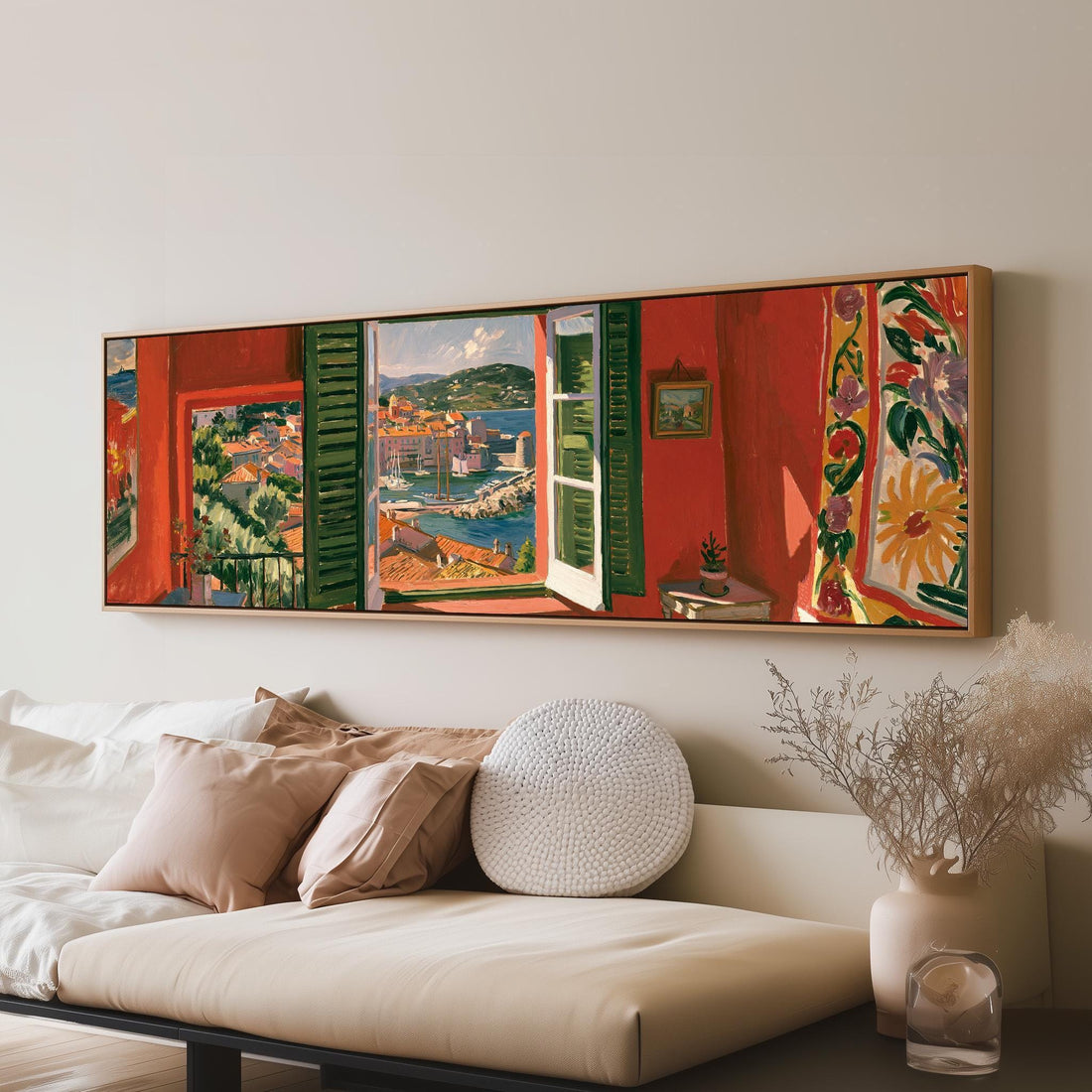 Saint Tropez harbor through a red room window long horizontal canvas print above a sofa in a living room