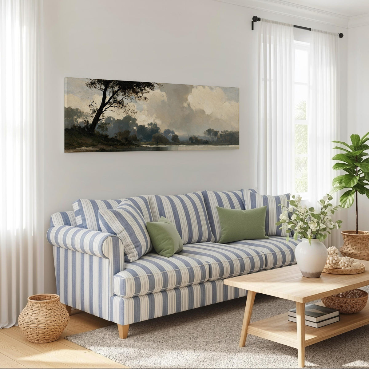 Misty river landscape in grey blue tones long horizontal canvas print above a striped sofa in a coastal living room
