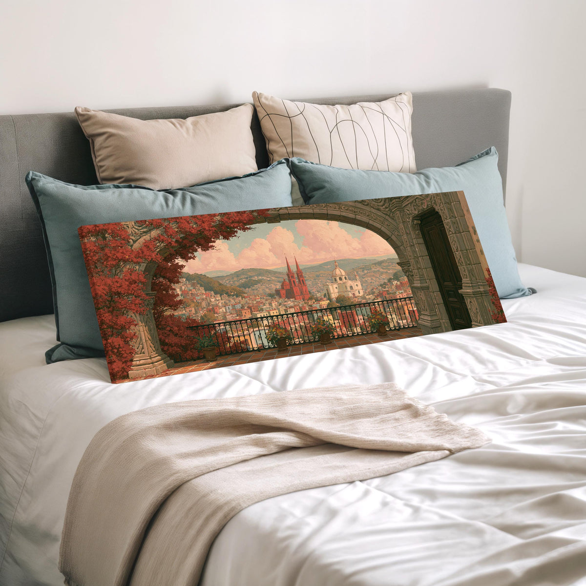 Old world city view through an archway wide panoramic canvas print laid on a bed to show its size