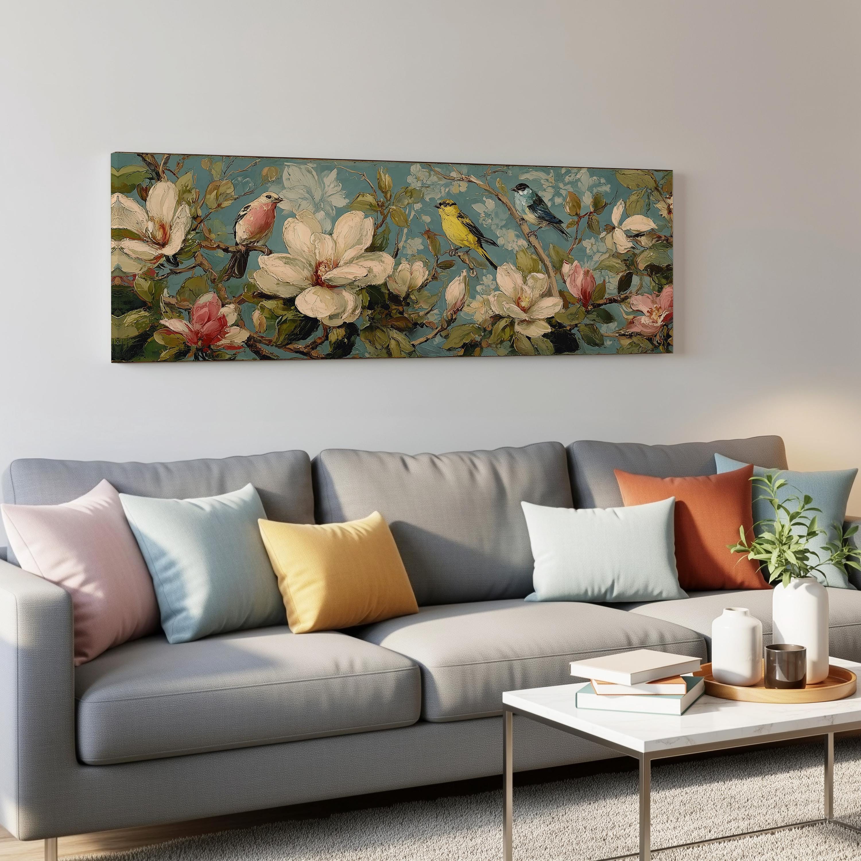 a gray couch with colorful throw pillows, a coffee table, and a large floral painting hanging on the wall above the couch.