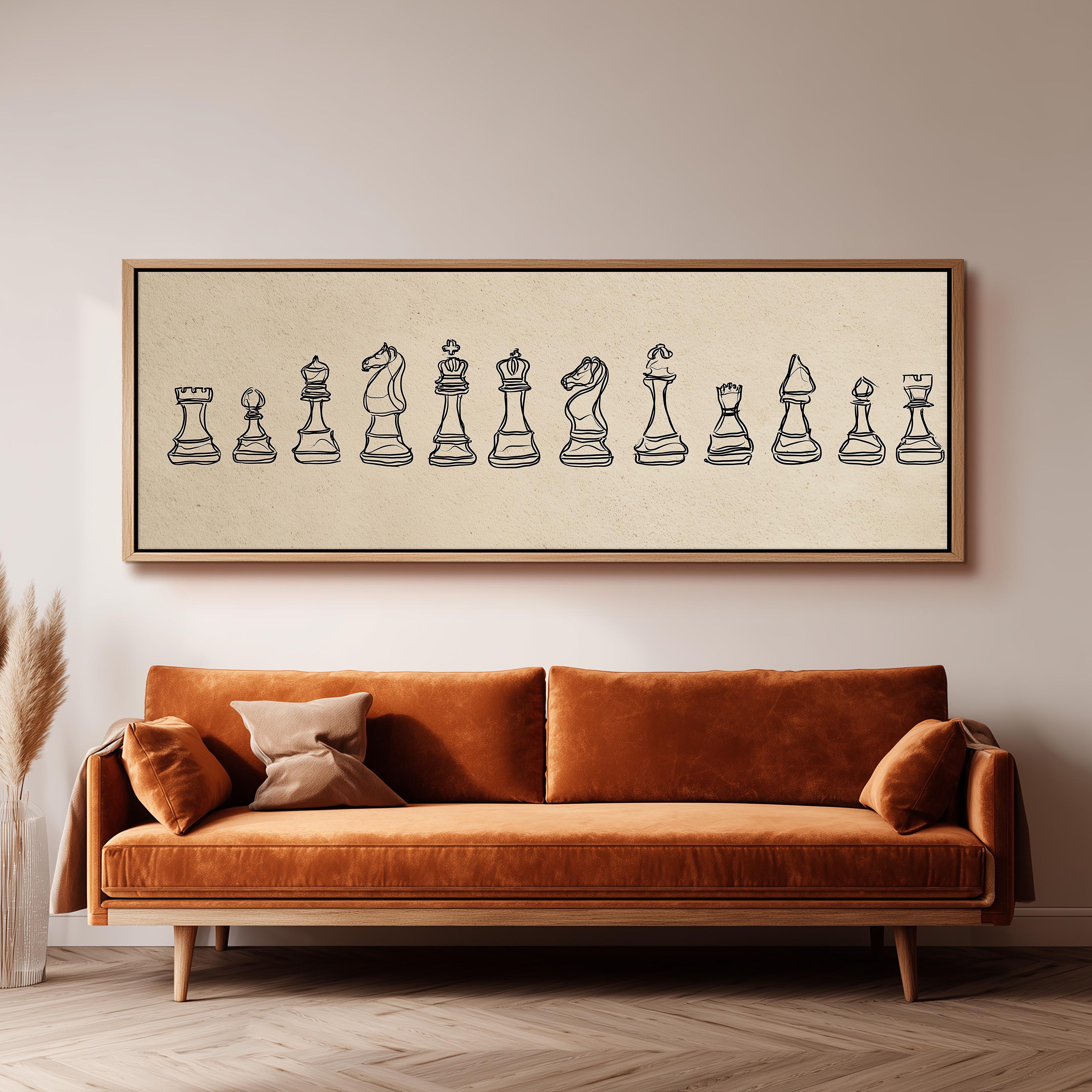 a large, framed artwork of chess pieces hanging on a wall above a brown sofa.