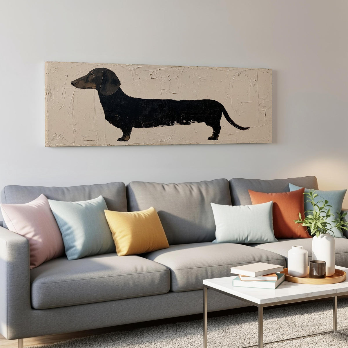 Black dachshund silhouette panoramic canvas print above a grey sofa in a living room