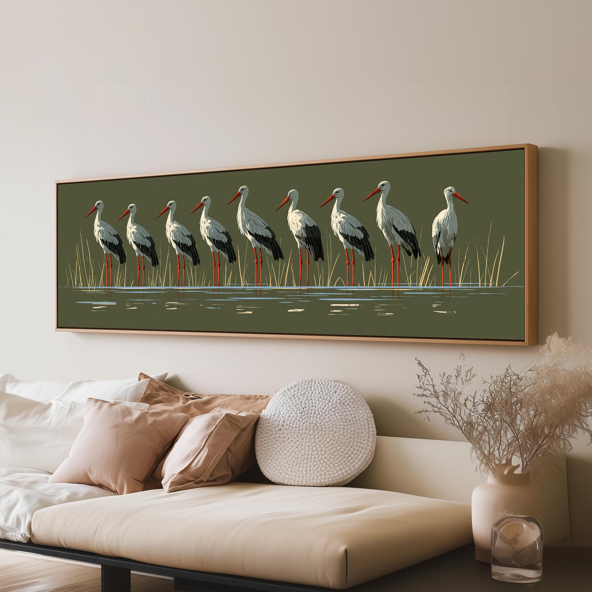 Flock of storks on olive green long horizontal canvas print above a sofa in a living room