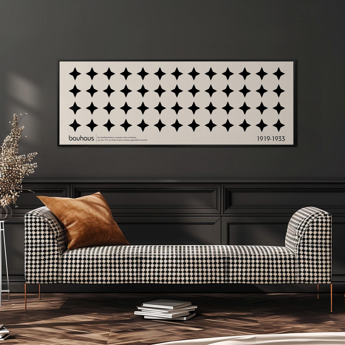 a modern black and white checkered sofa with a brown throw pillow, set against a dark wall with a framed poster above it.