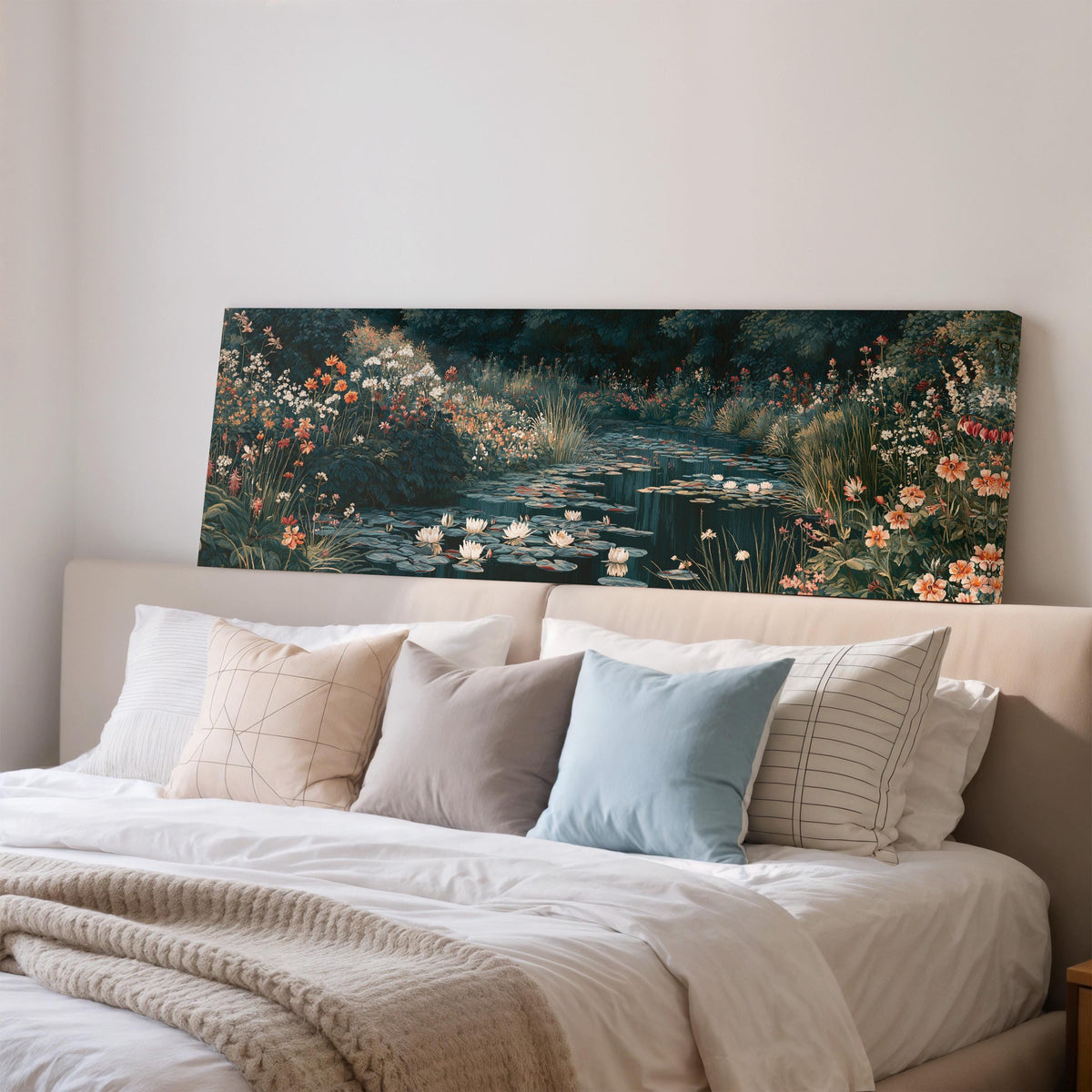 Lily pond surrounded by wildflowers wide panoramic canvas print above a bed in a bedroom