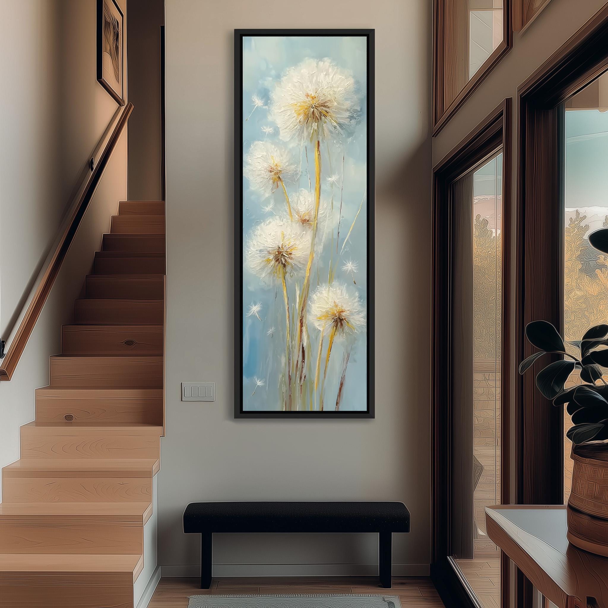 a hallway with a large painting of dandelions hanging on the wall. The painting is framed and appears to be a close-up of the dandelion flowers. The hallway has a wooden staircase and a bench, creating a cozy and inviting atmosphere.