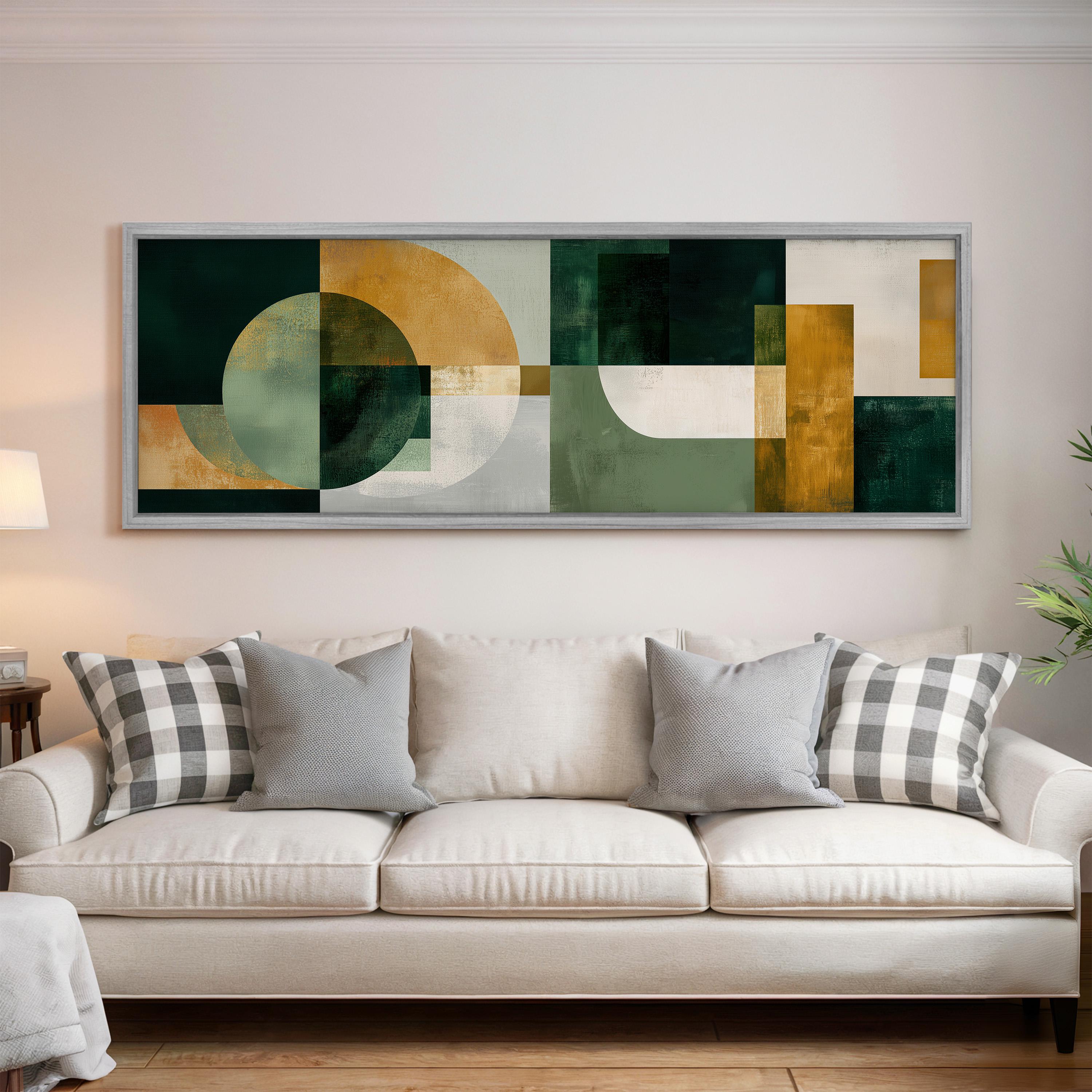 a large abstract painting hanging on a wall above a white couch with gray and white plaid throw pillows.