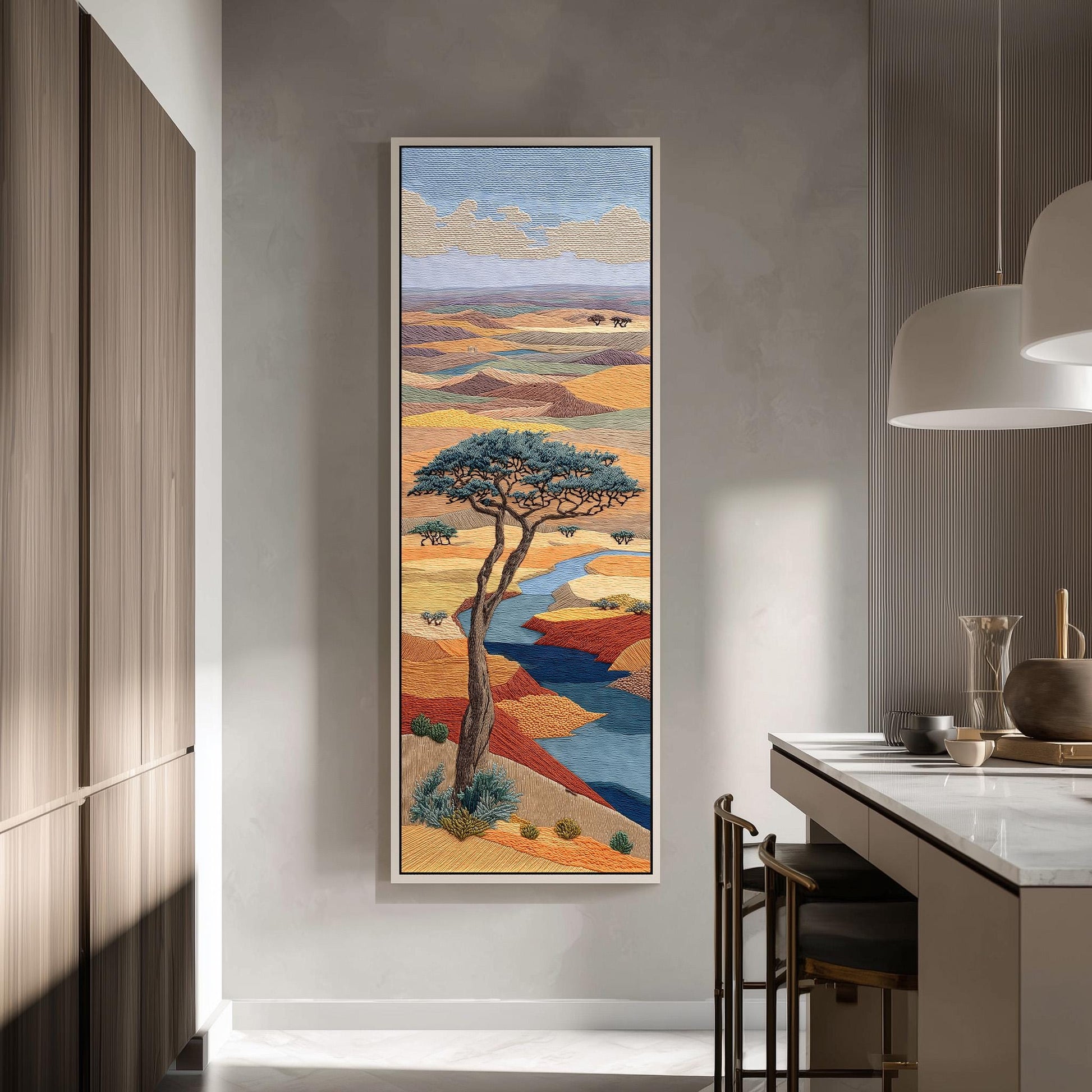 a large, colorful painting of a landscape hanging on a wall in a modern kitchen.