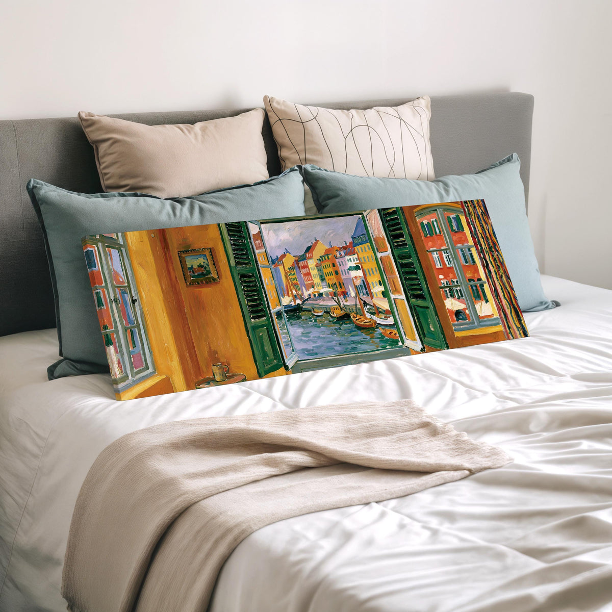 Copenhagen's colorful canal through a window wide panoramic canvas print laid on a bed to show its size