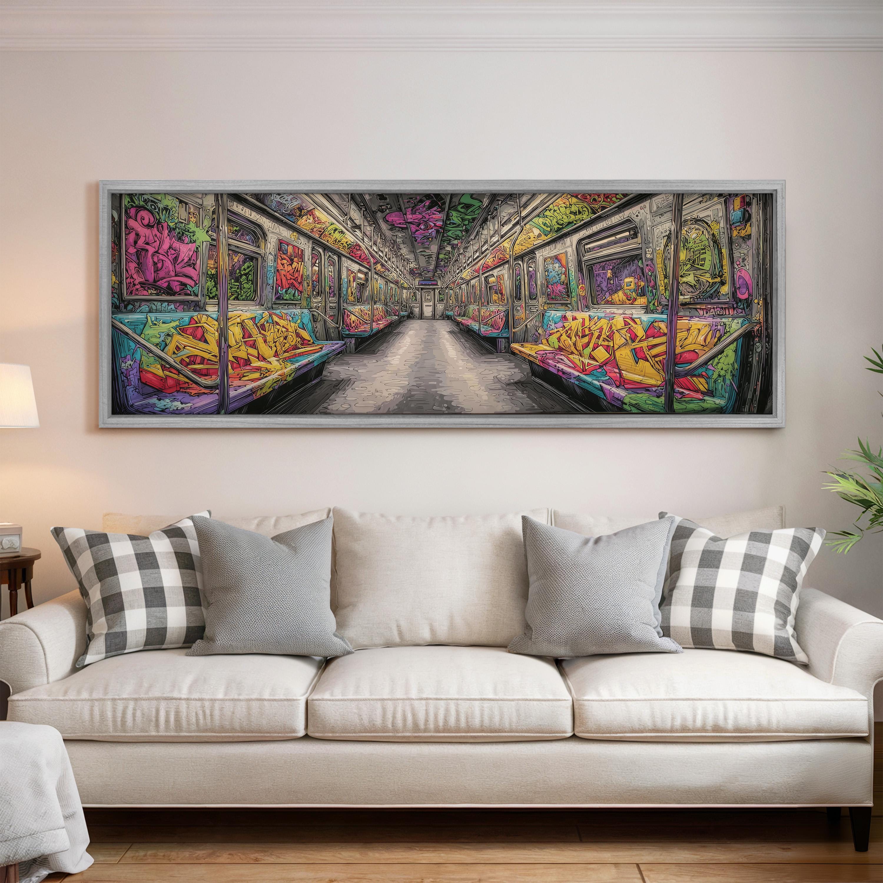 a large, colorful painting of a subway car with graffiti on the walls, hanging on a wall above a white couch with pillows.