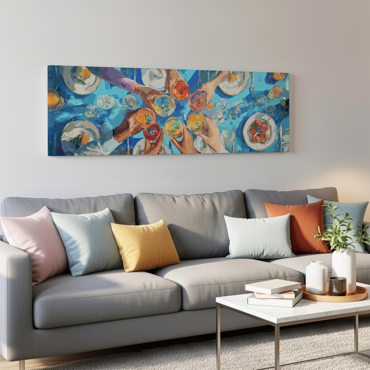 Friends toasting over a blue table from above panoramic canvas print above a grey sofa in a living room