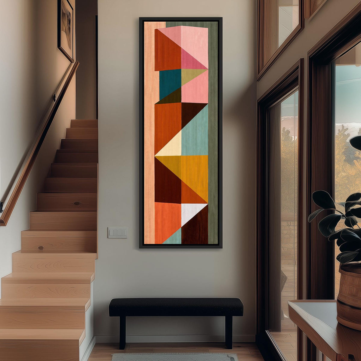Stacked colorful triangle mosaic tall narrow canvas print beside a staircase in an entryway