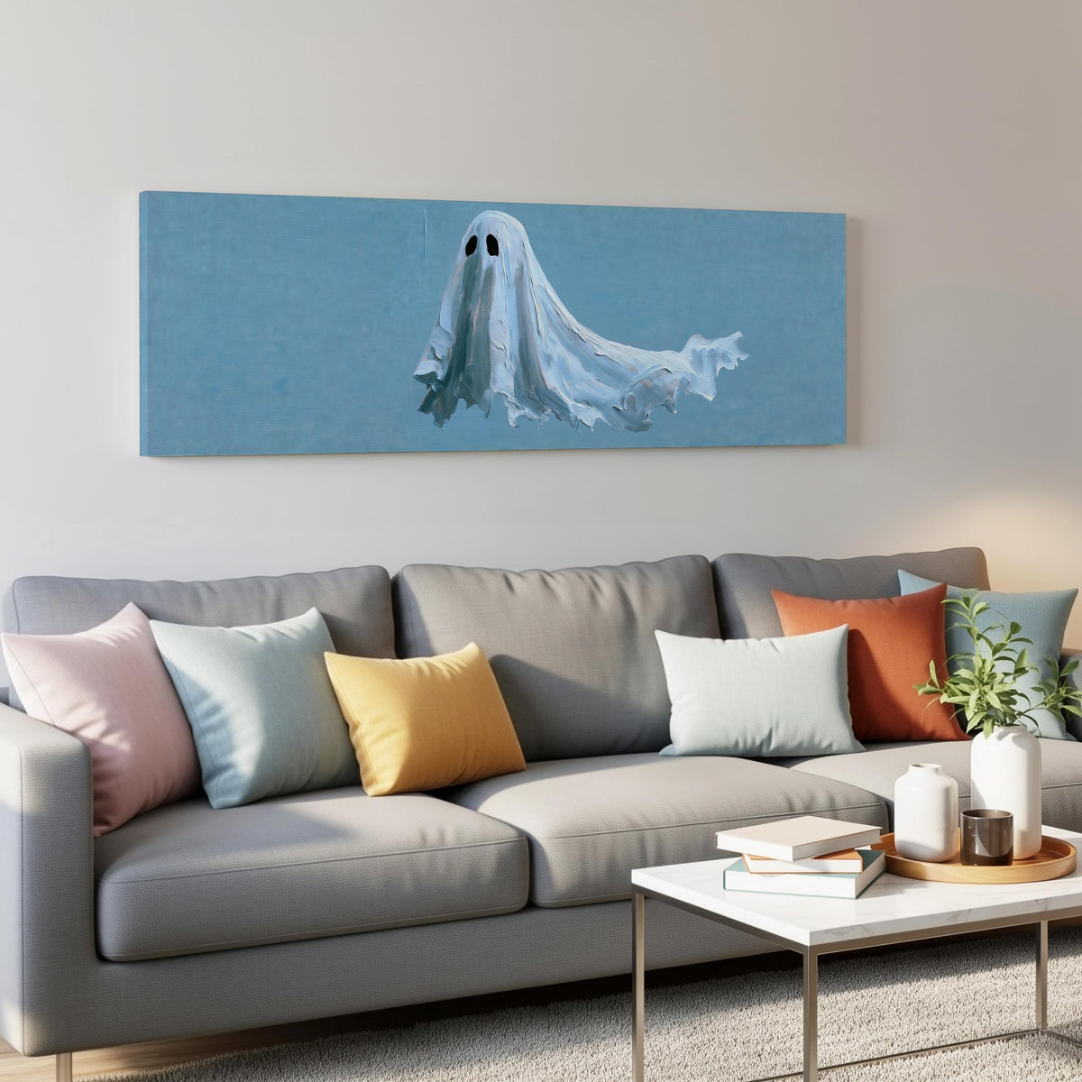 Floating ghost on blue panoramic canvas print above a grey sofa in a living room