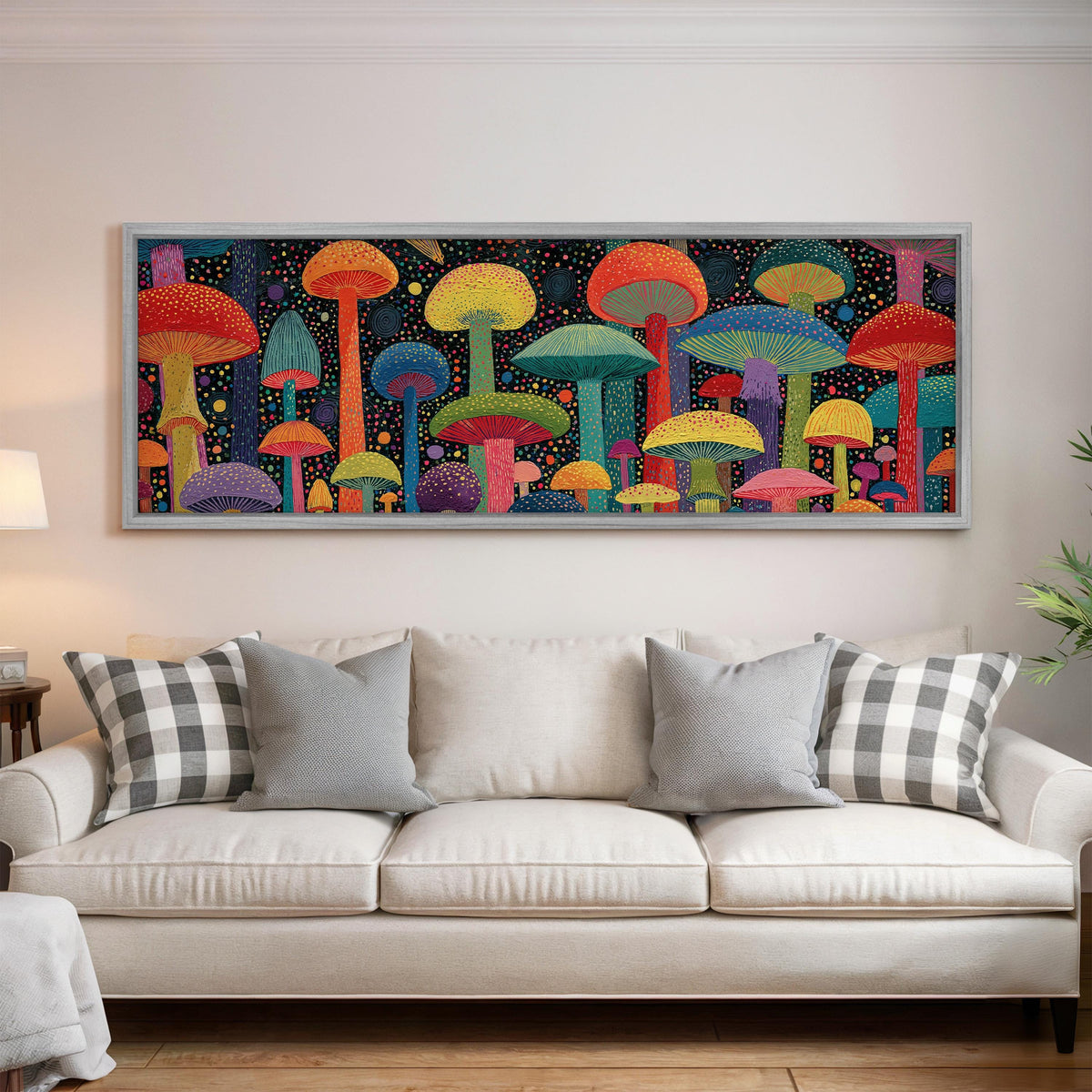 Colorful dotted mushrooms at midnight panoramic canvas print above a white sofa in a bright living room