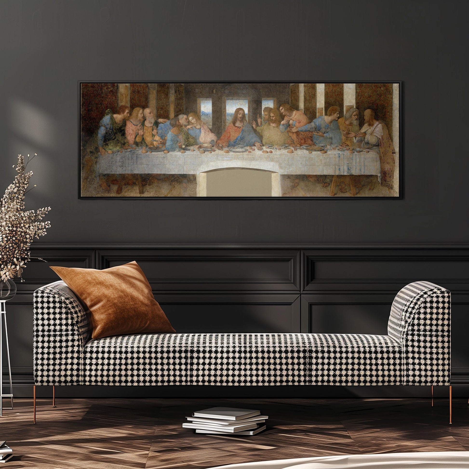 a large painting of the Last Supper hanging on a wall above a black and white checkered sofa.