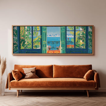 Riviera balcony view through open windows long horizontal canvas print above a sofa in a living room