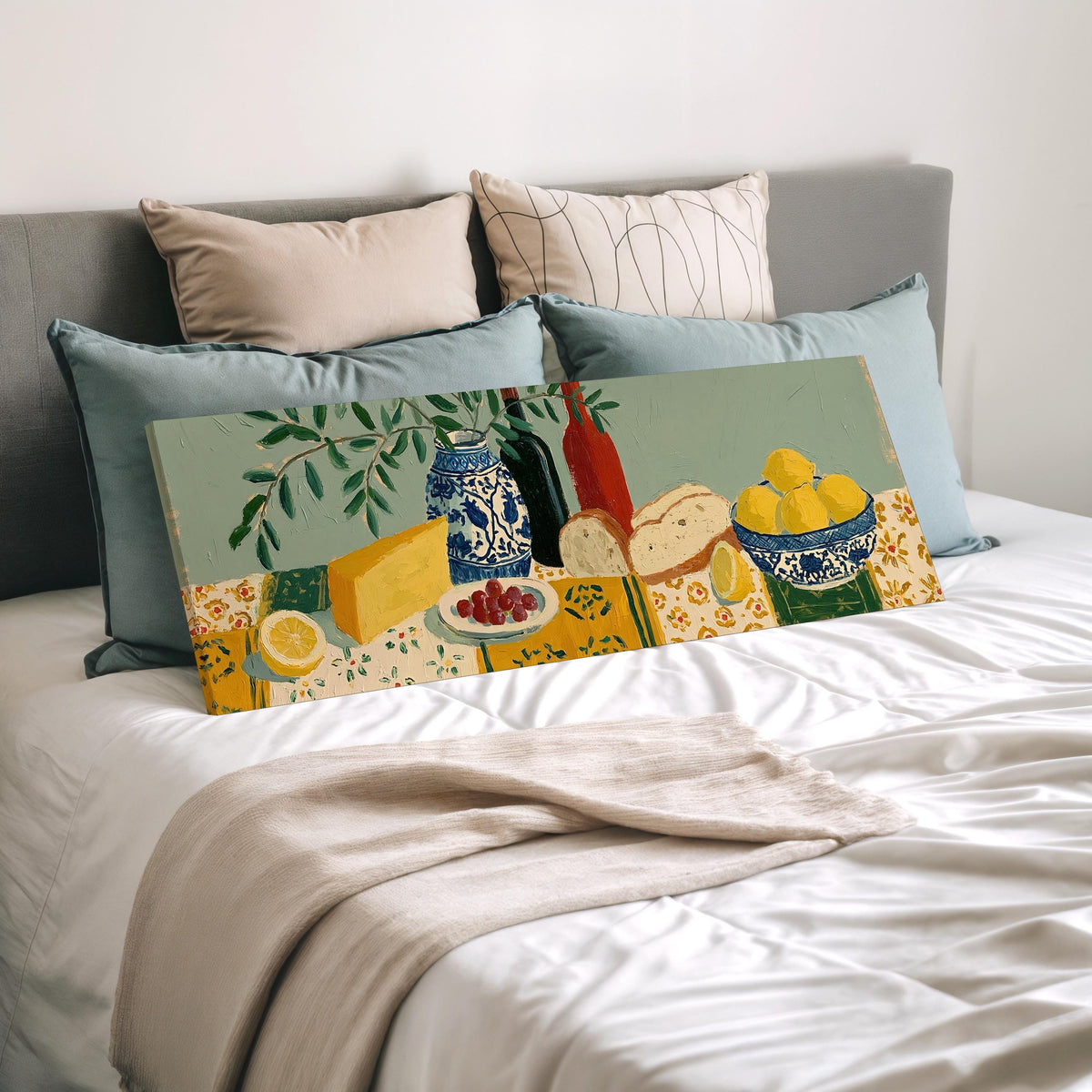 Cheese, wine and lemon spread wide panoramic canvas print laid on a bed to show its size