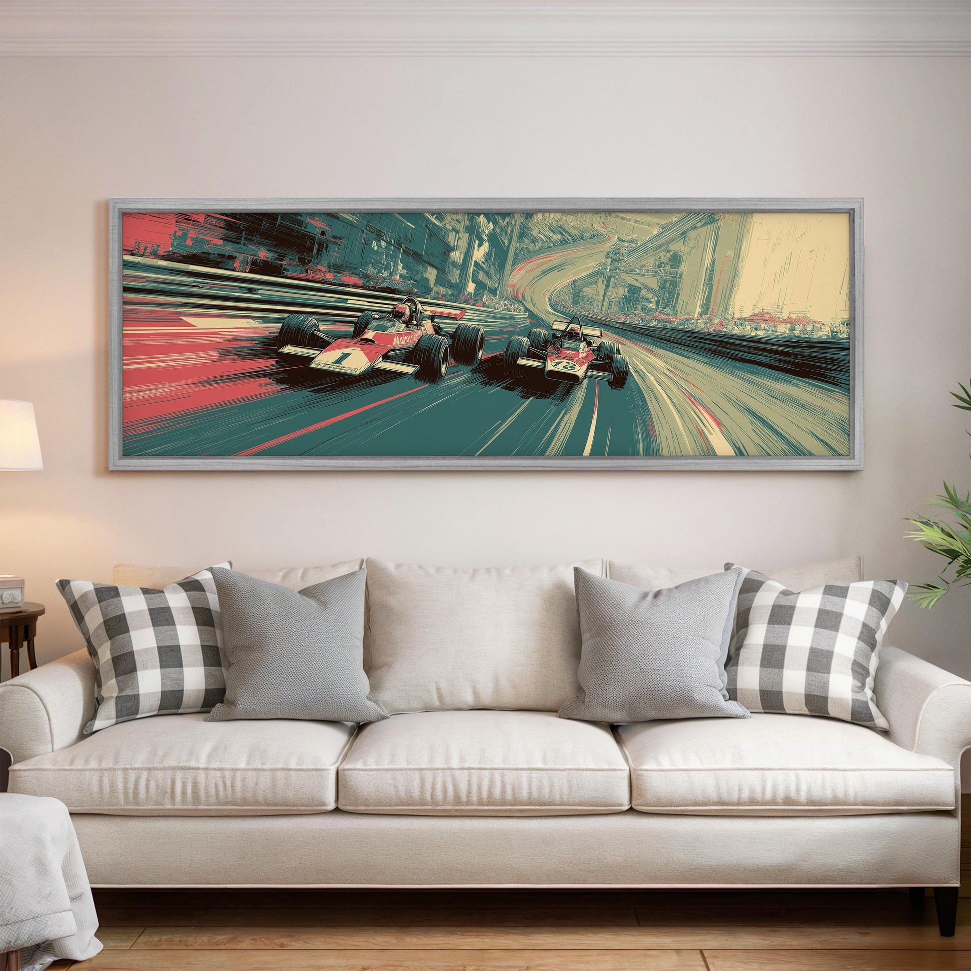 a large, colorful painting of two race cars speeding down a track, hanging on a wall above a white couch with patterned throw pillows.