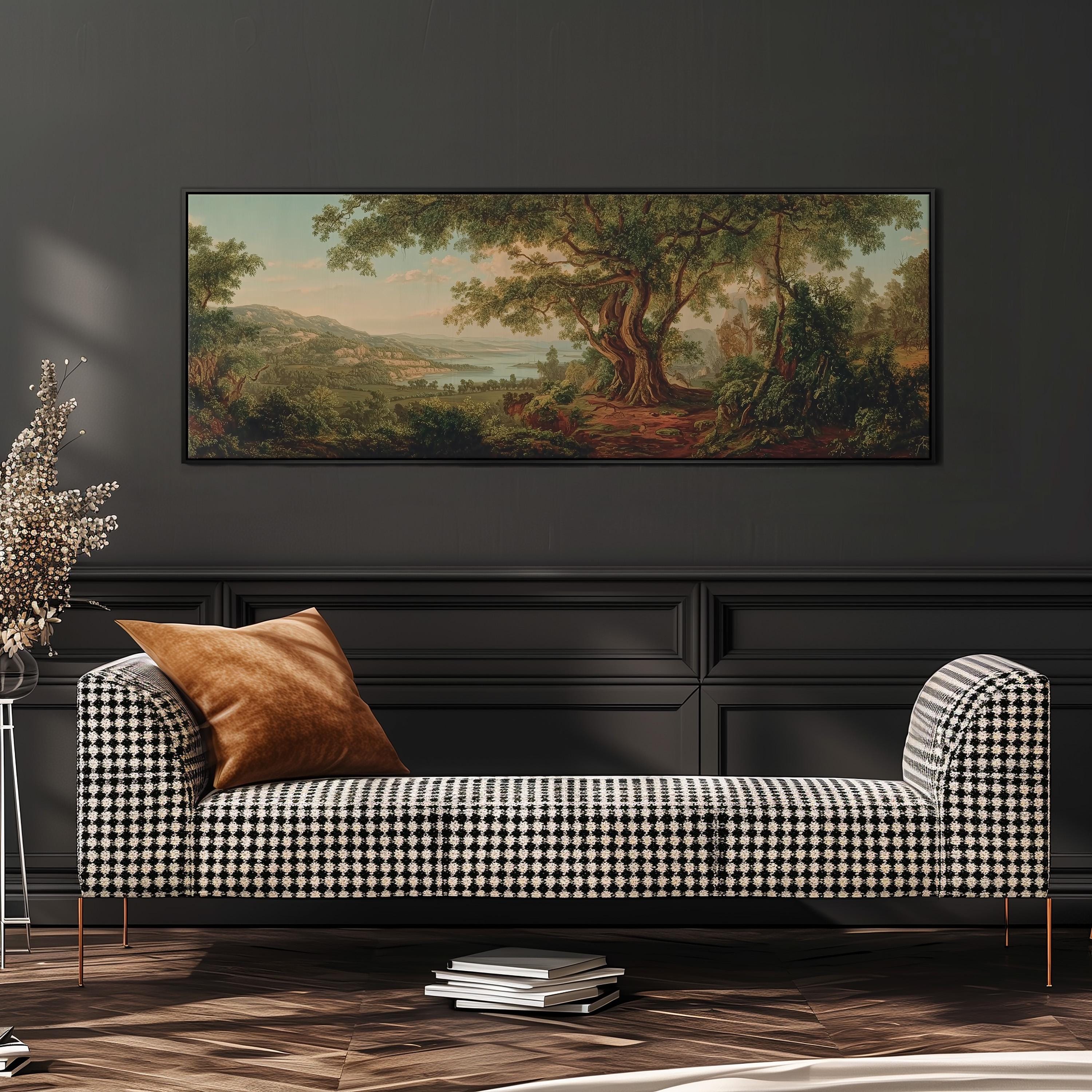 a large painting of a forest landscape hanging on a wall above a black and white checkered sofa with a brown throw pillow.
