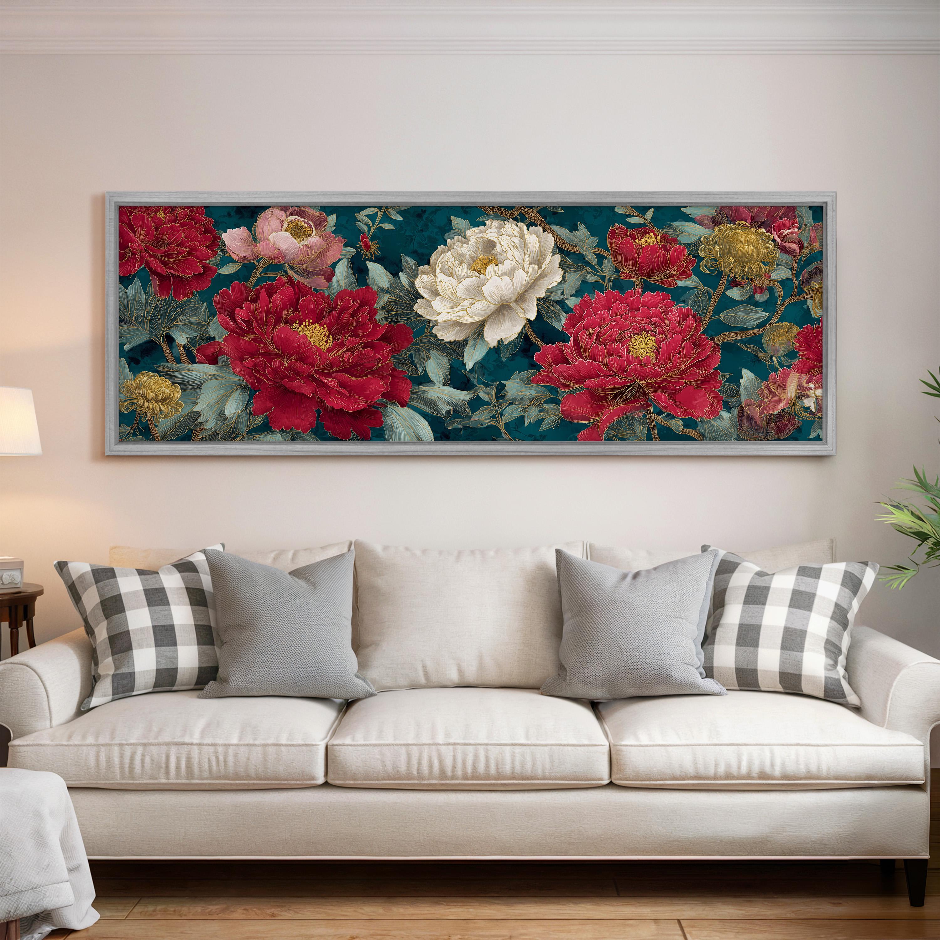 a large floral painting hanging on a wall above a white couch with gray and white plaid throw pillows.