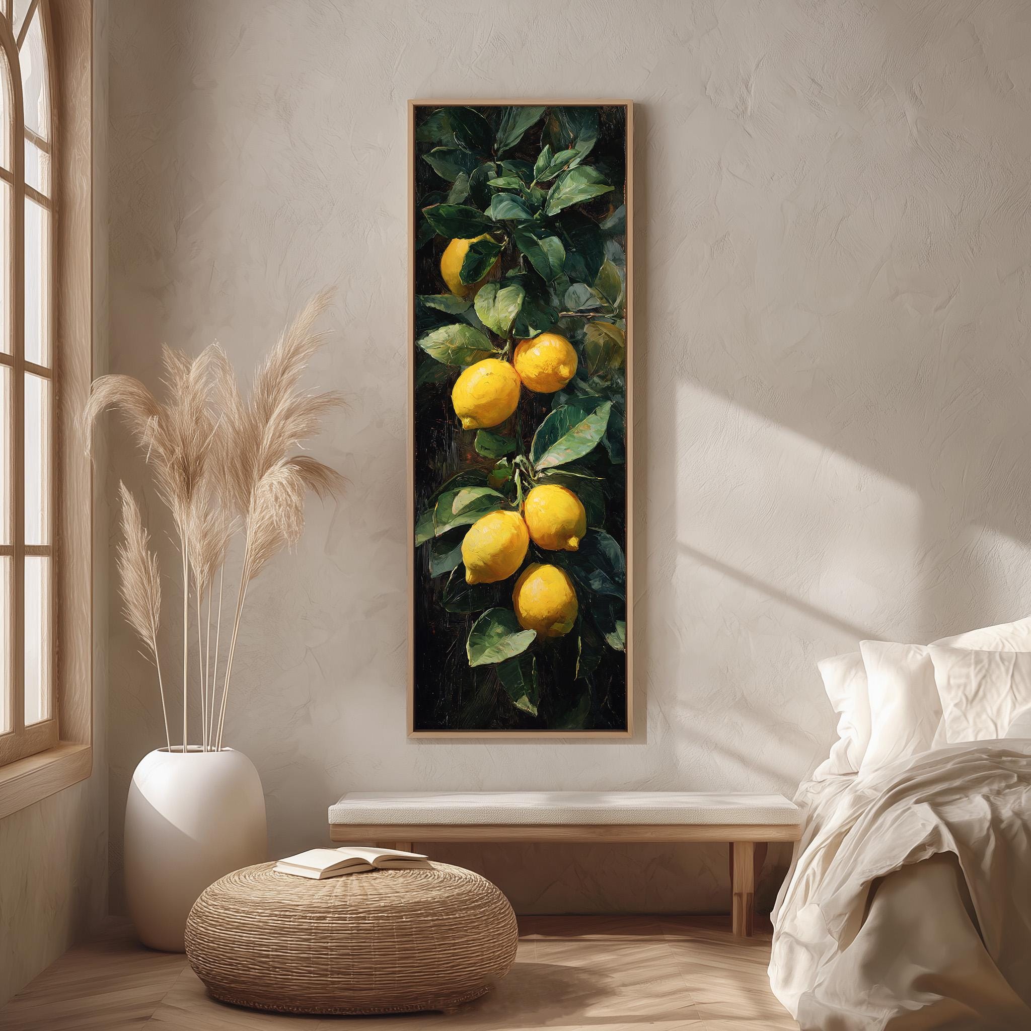 a large painting of lemons hanging on a wall, with a potted plant and a woven ottoman in the foreground.