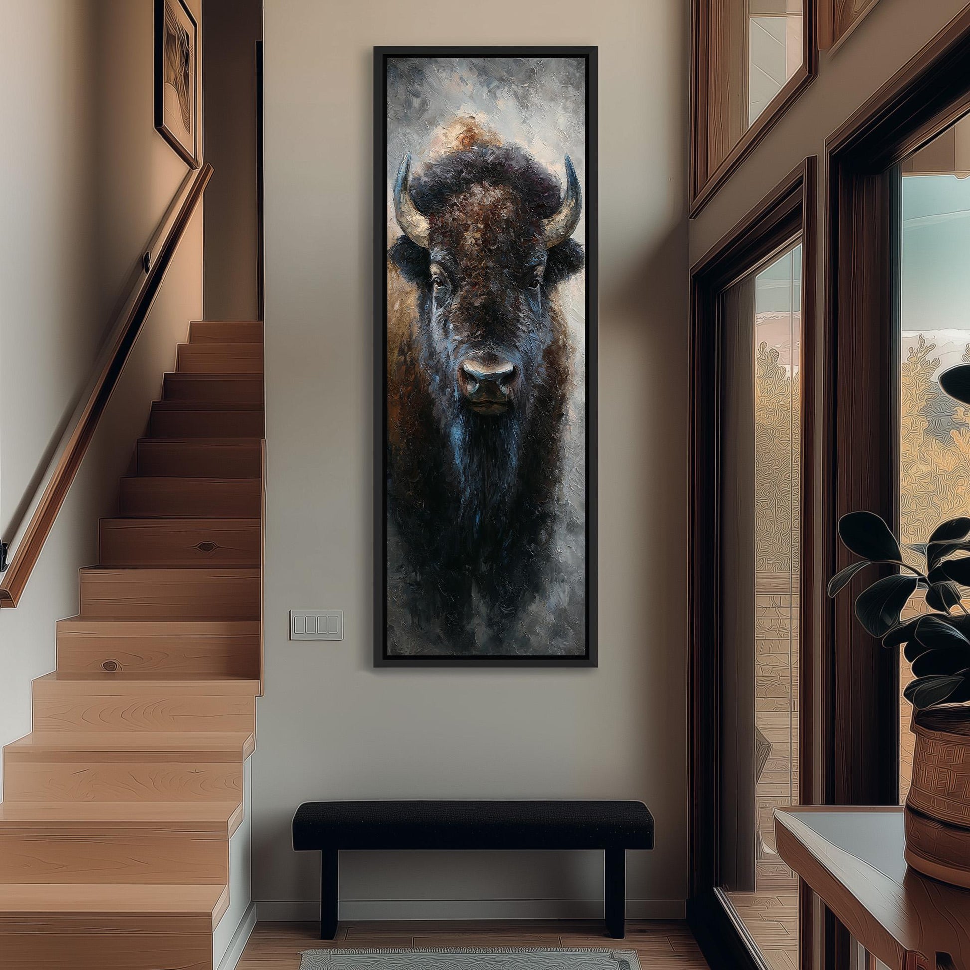 a large painting of a buffalo's face hanging on the wall of a hallway.