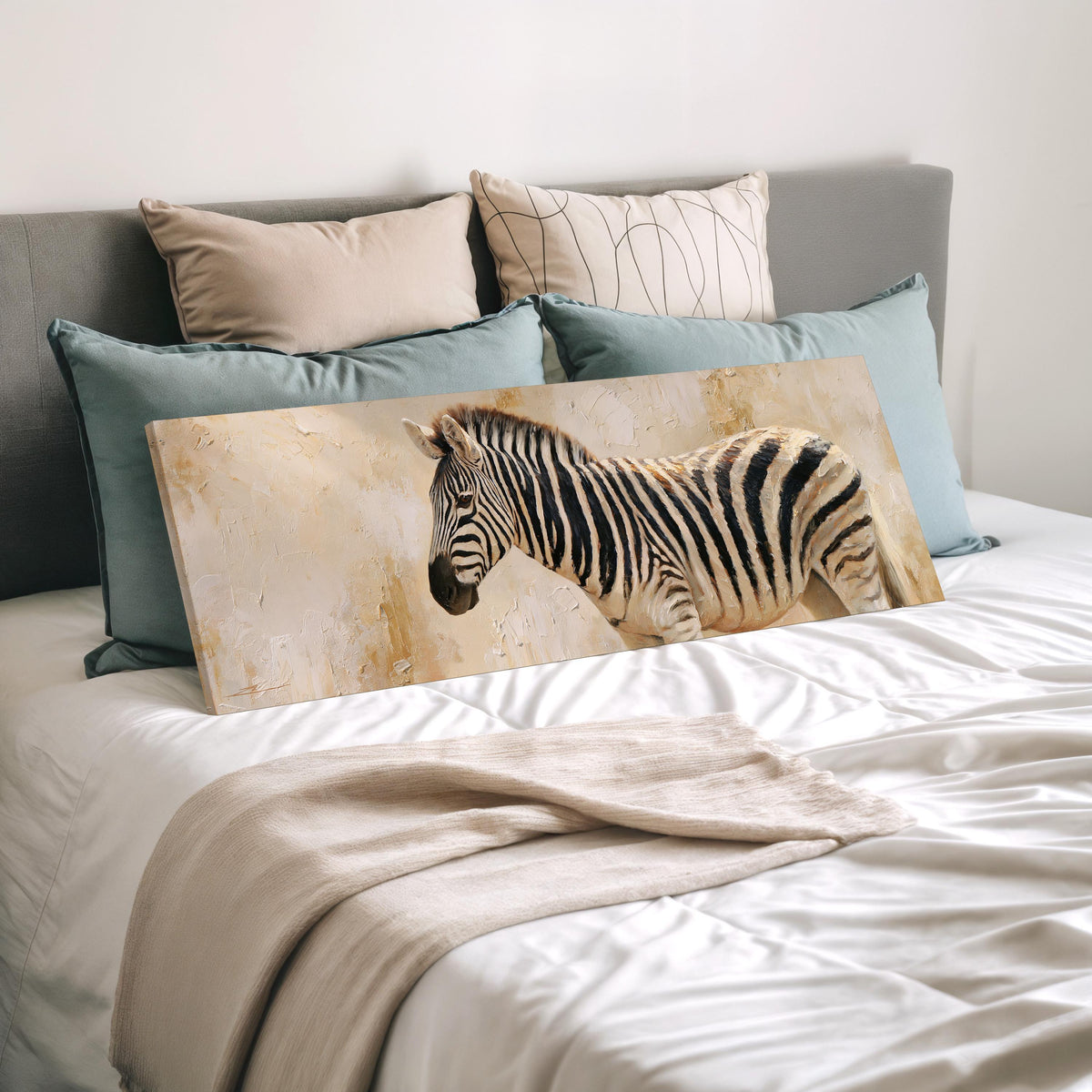 Zebra on a sandy textured background wide panoramic canvas print laid on a bed to show its size