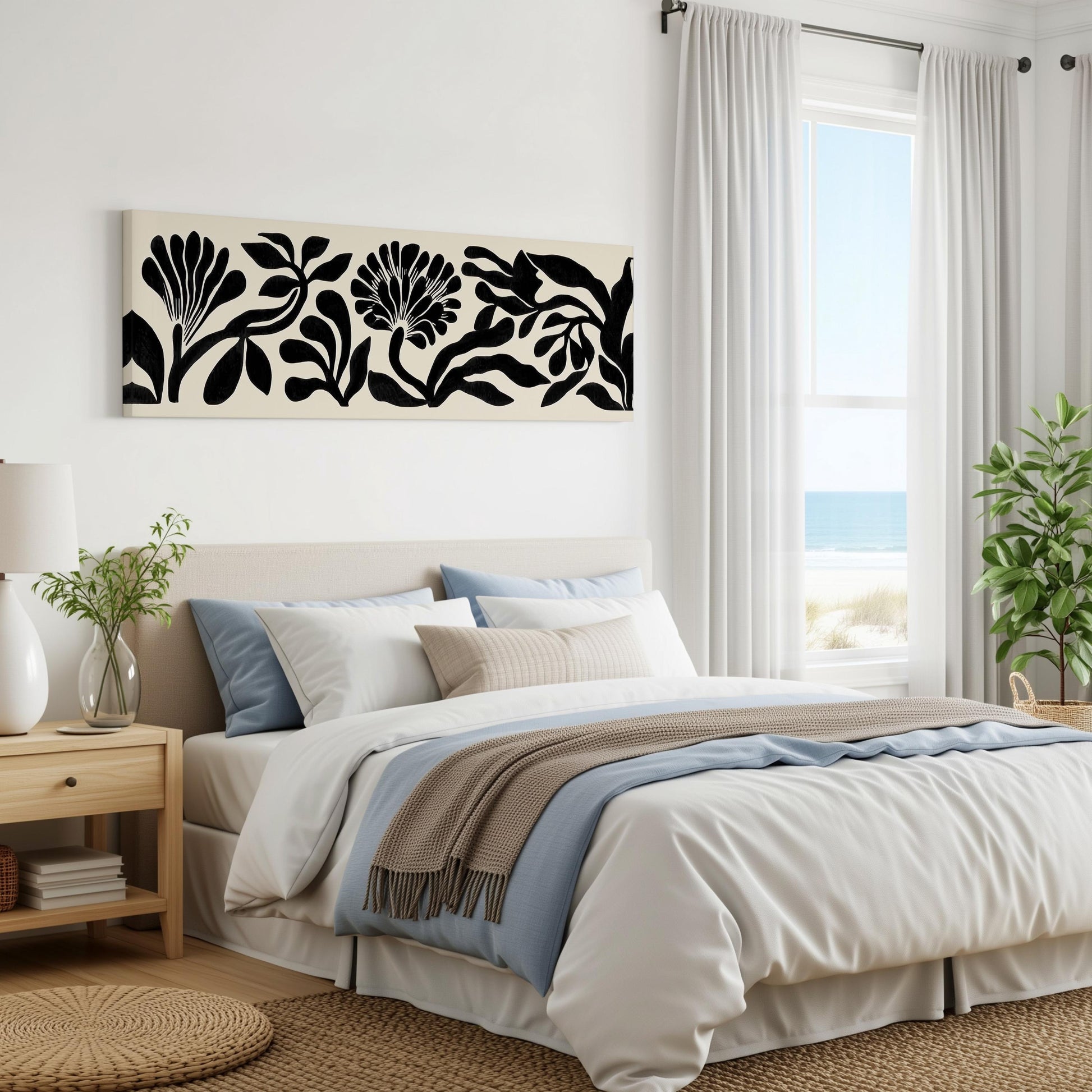 a serene and modern bedroom with a large bed, a nightstand, and a window overlooking the ocean. The room has a minimalist and clean design, with white walls and a neutral color palette.
