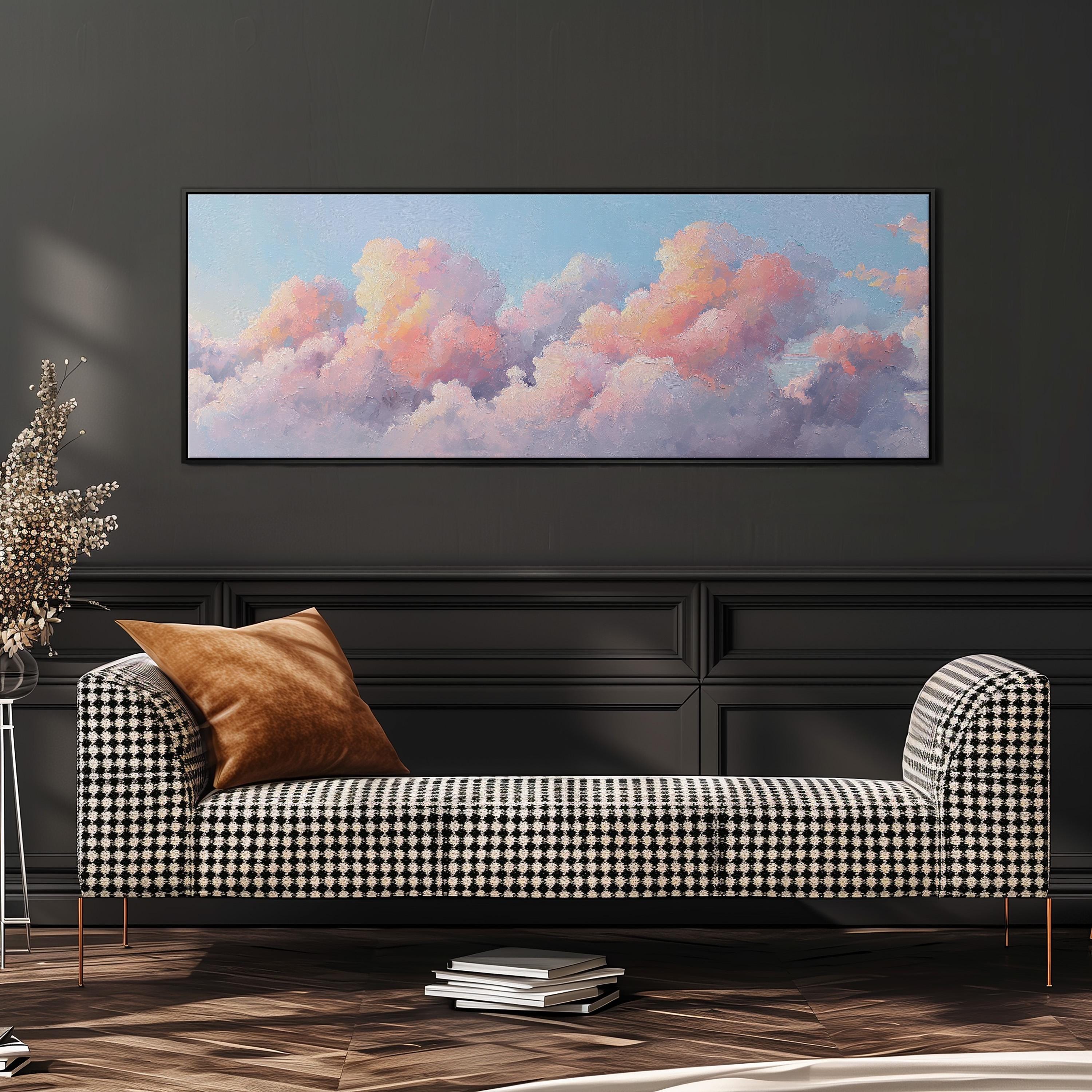 a black and white checkered sofa with a brown throw pillow, set against a dark wall with a large framed painting of a cloudy sky above it.
