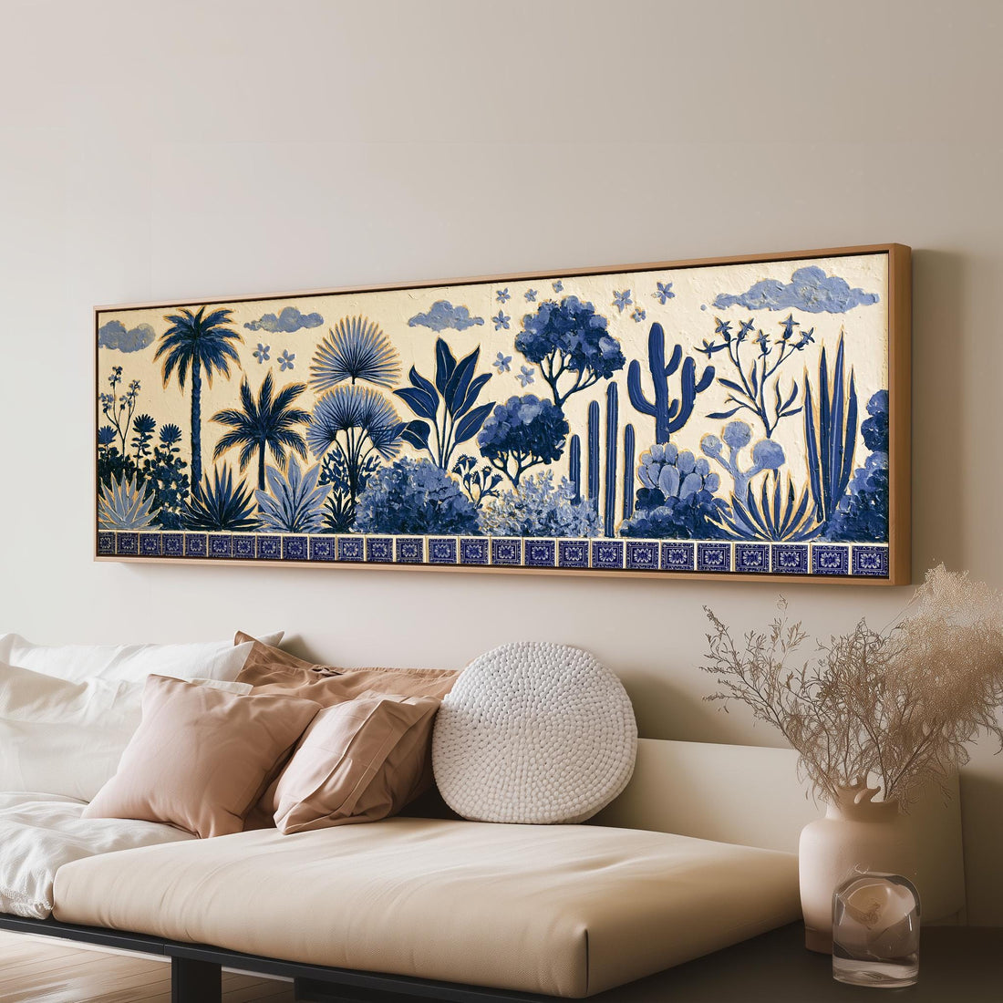 Blue palms, cacti and flowers pattern long horizontal canvas print above a sofa in a living room