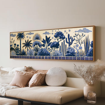 Blue palms, cacti and flowers pattern long horizontal canvas print above a sofa in a living room