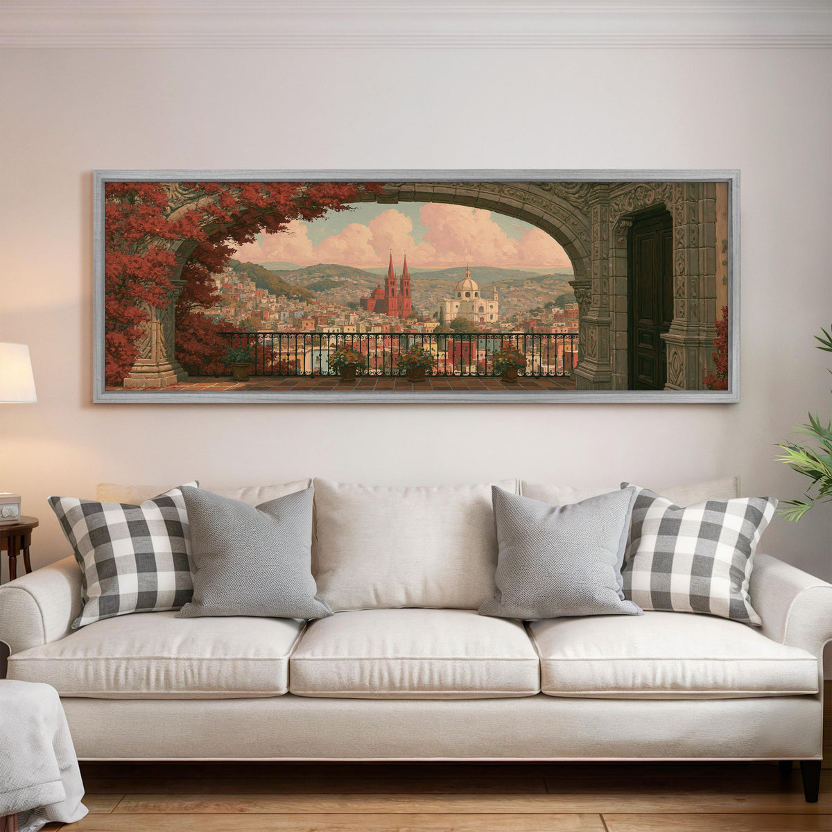 Old world city view through an archway panoramic canvas print above a white sofa in a bright living room