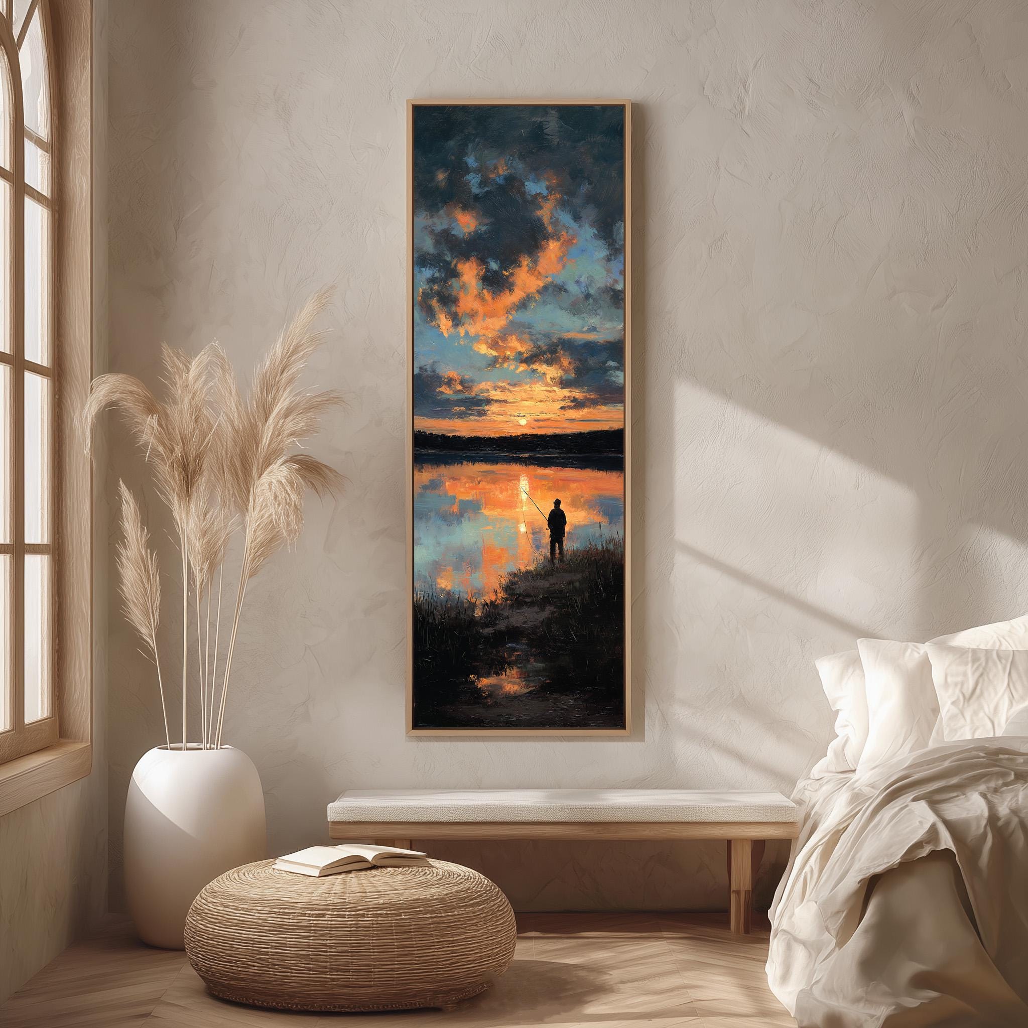 a serene bedroom scene with a large painting of a sunset over a lake hanging on the wall. The painting captures the reflection of the setting sun on the water, creating a tranquil atmosphere. The room is decorated with a large window, a white bed, and a wicker ottoman. The overall scene conveys a sense of calm and relaxation.